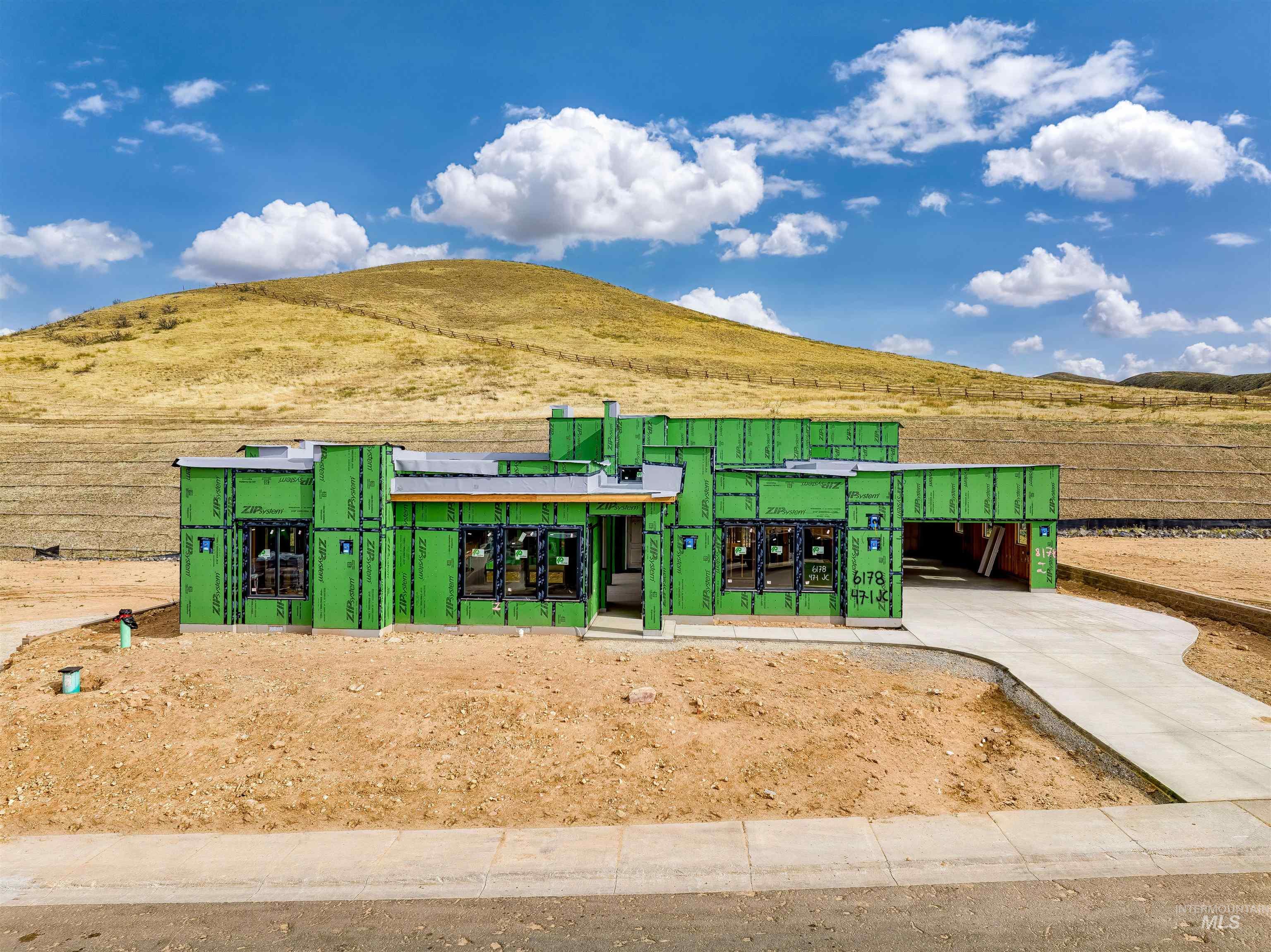 Horse barn featuring a mountain view