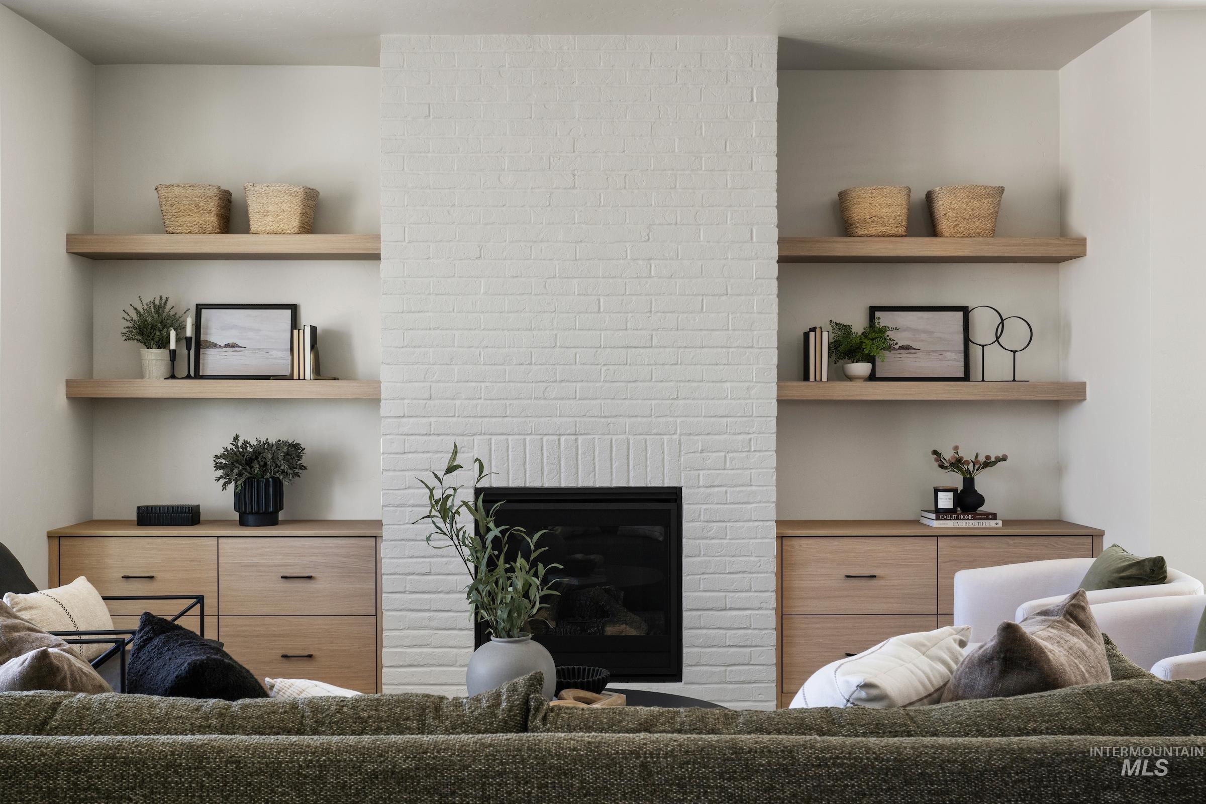 Living area featuring a brick fireplace
