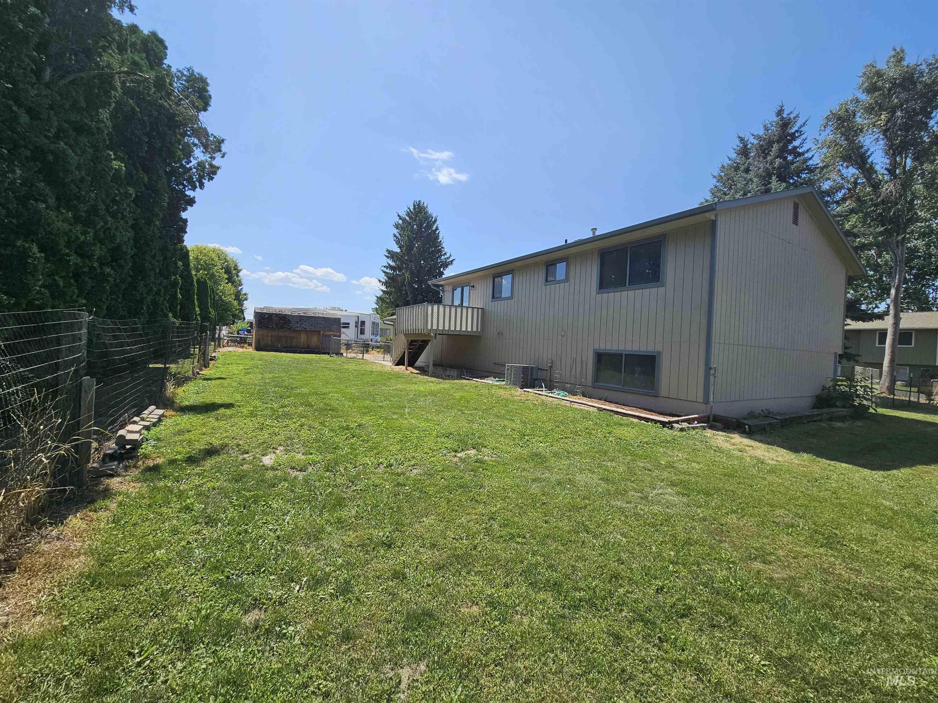 Back of house with a wooden deck