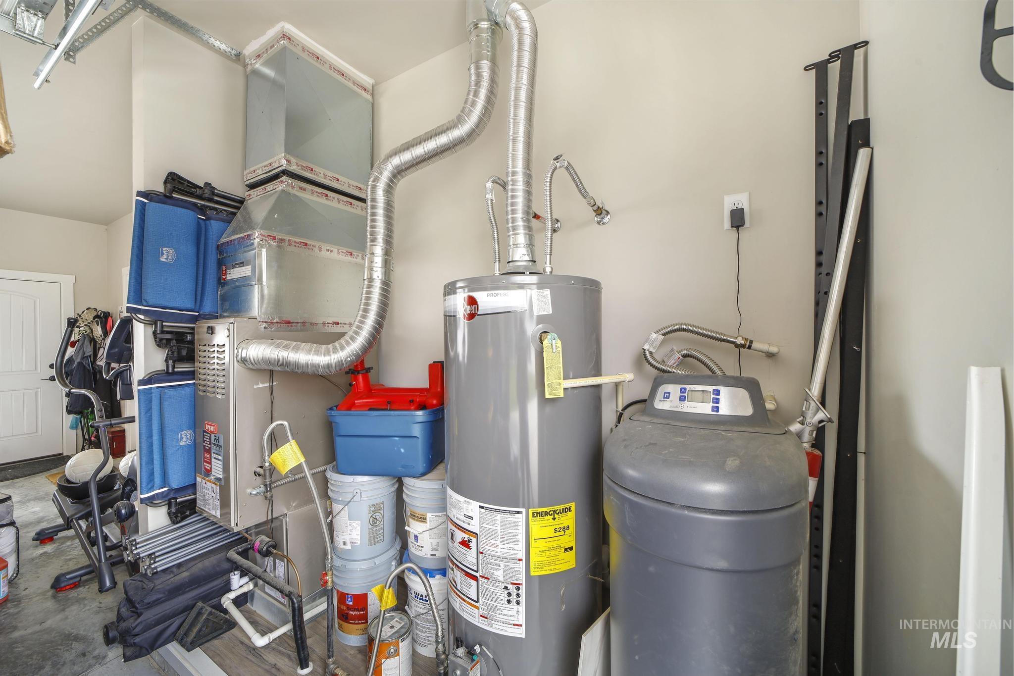 Utility room with water heater and heating unit