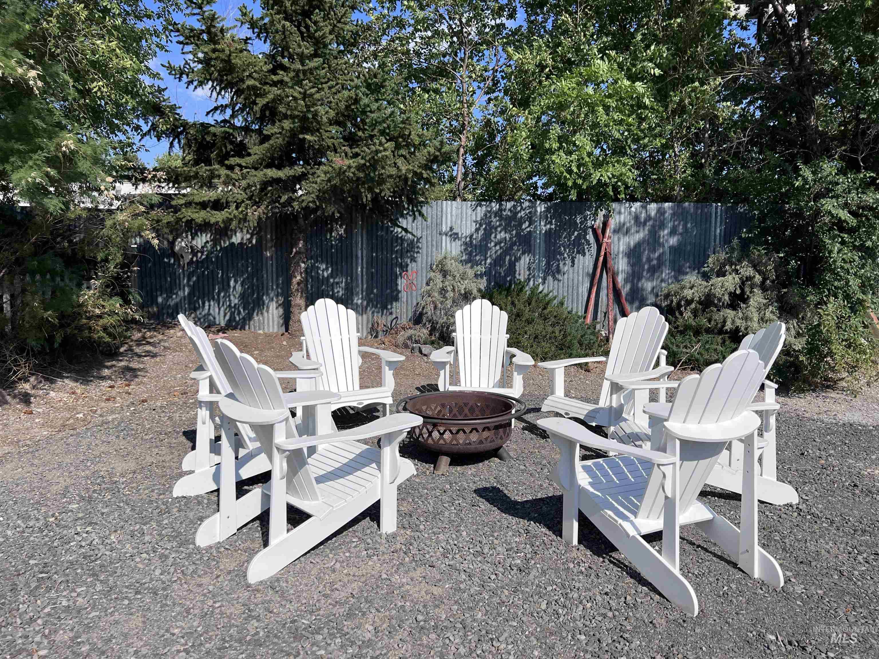 View of patio featuring an outdoor fire pit