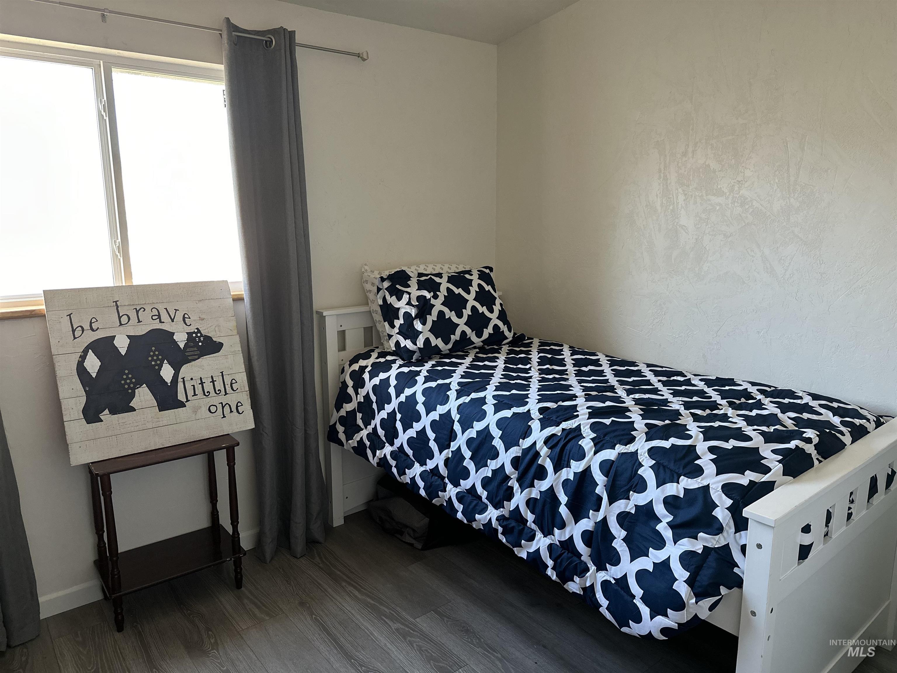 Bedroom featuring wood finished floors
