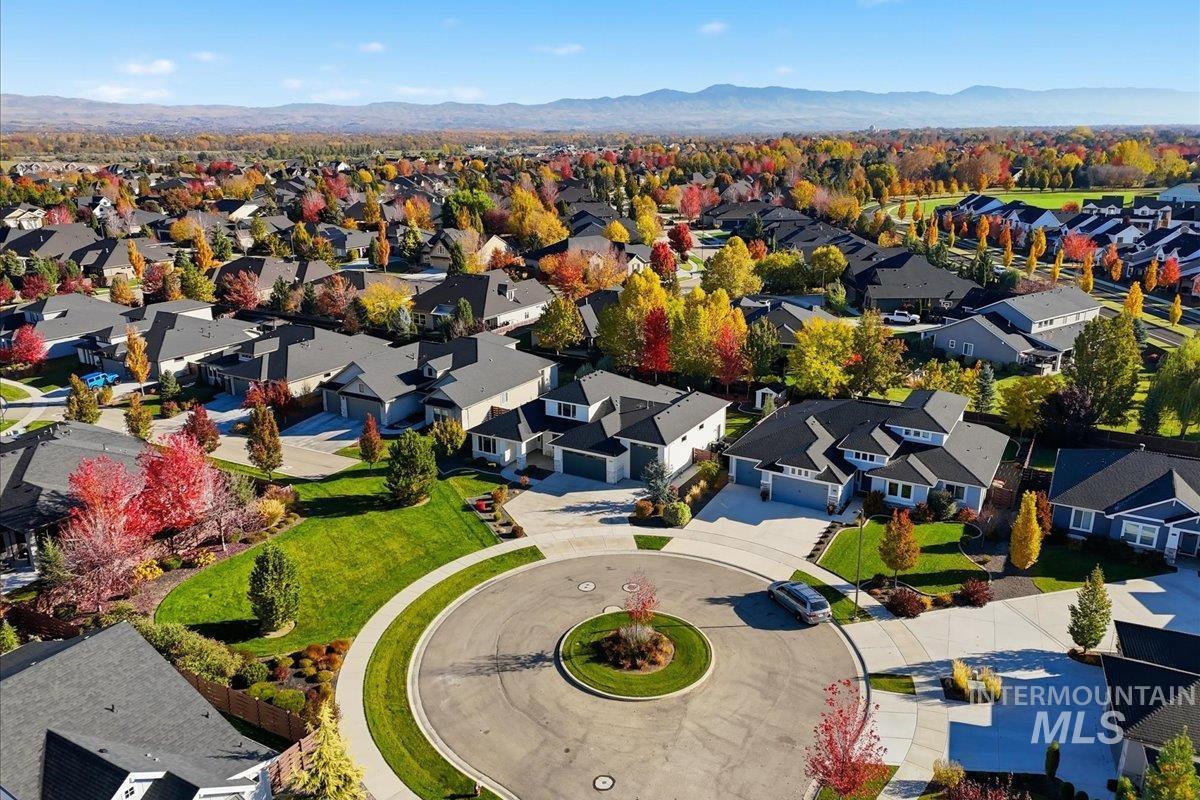 Aerial view of residential area featuring a mountain backdrop