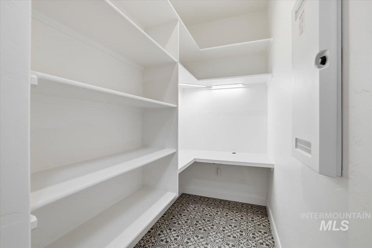 Spacious closet with light tile patterned flooring