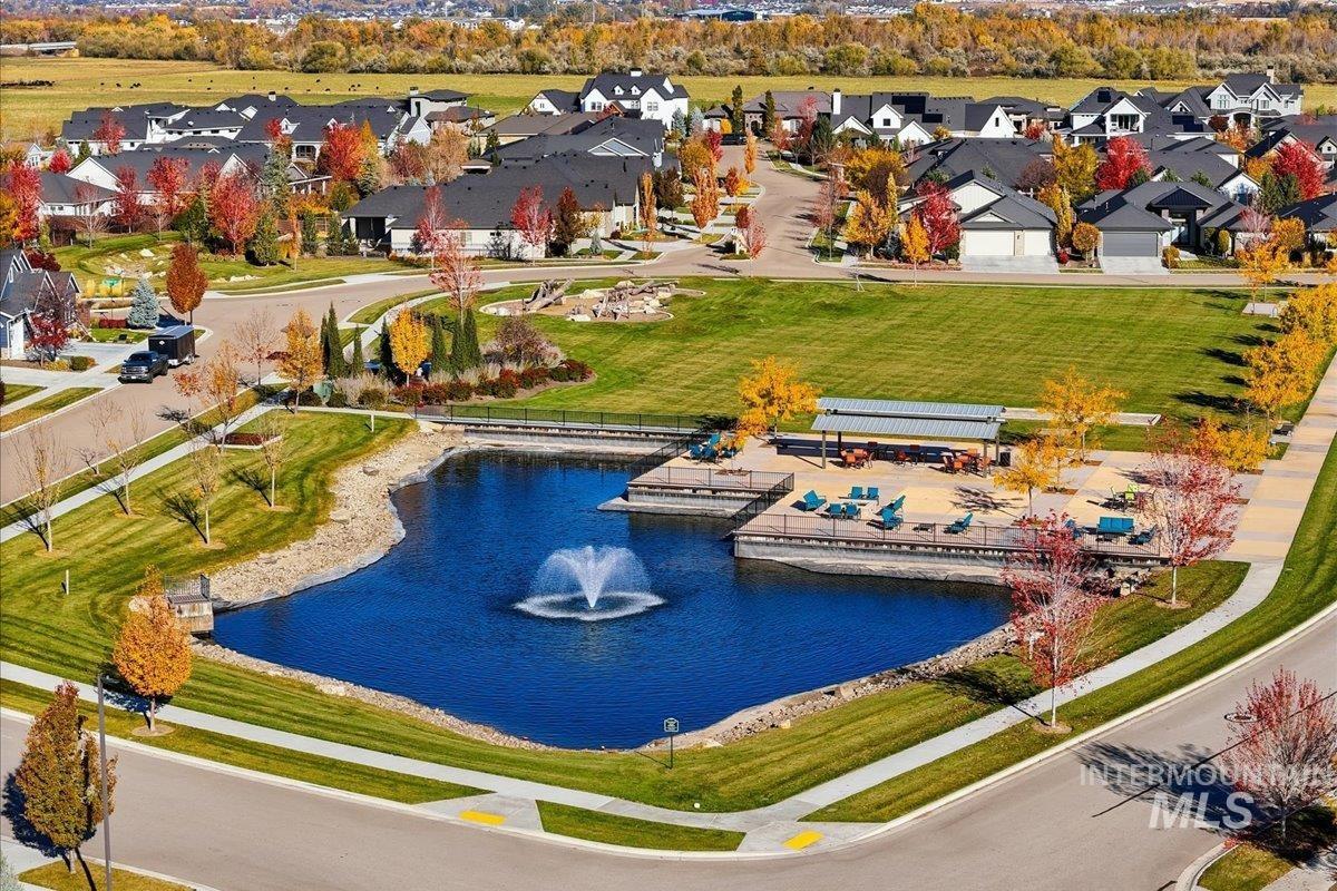 Aerial perspective of suburban area with a large body of water