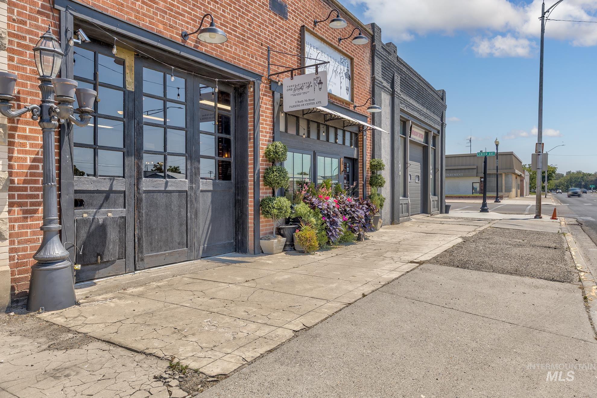Doorway to property featuring brick siding