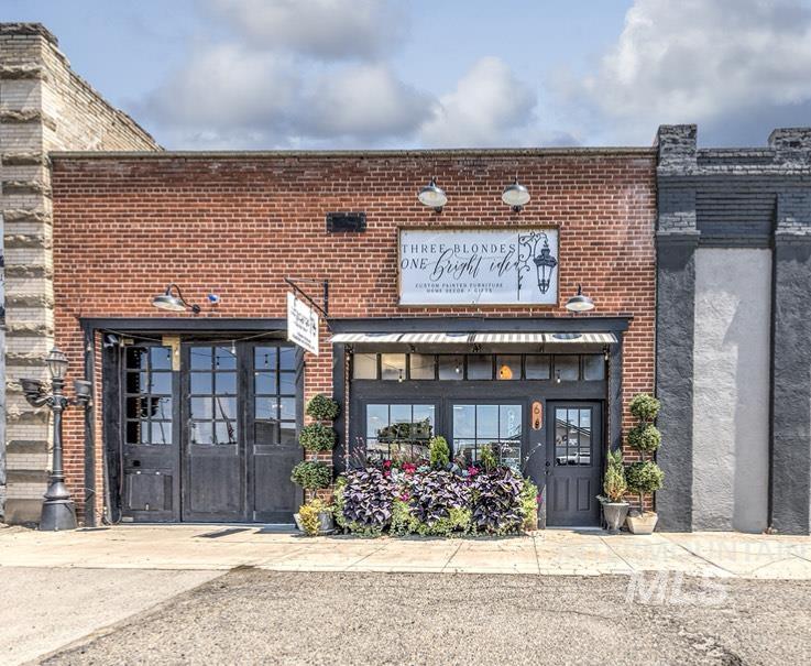Doorway to property with brick siding
