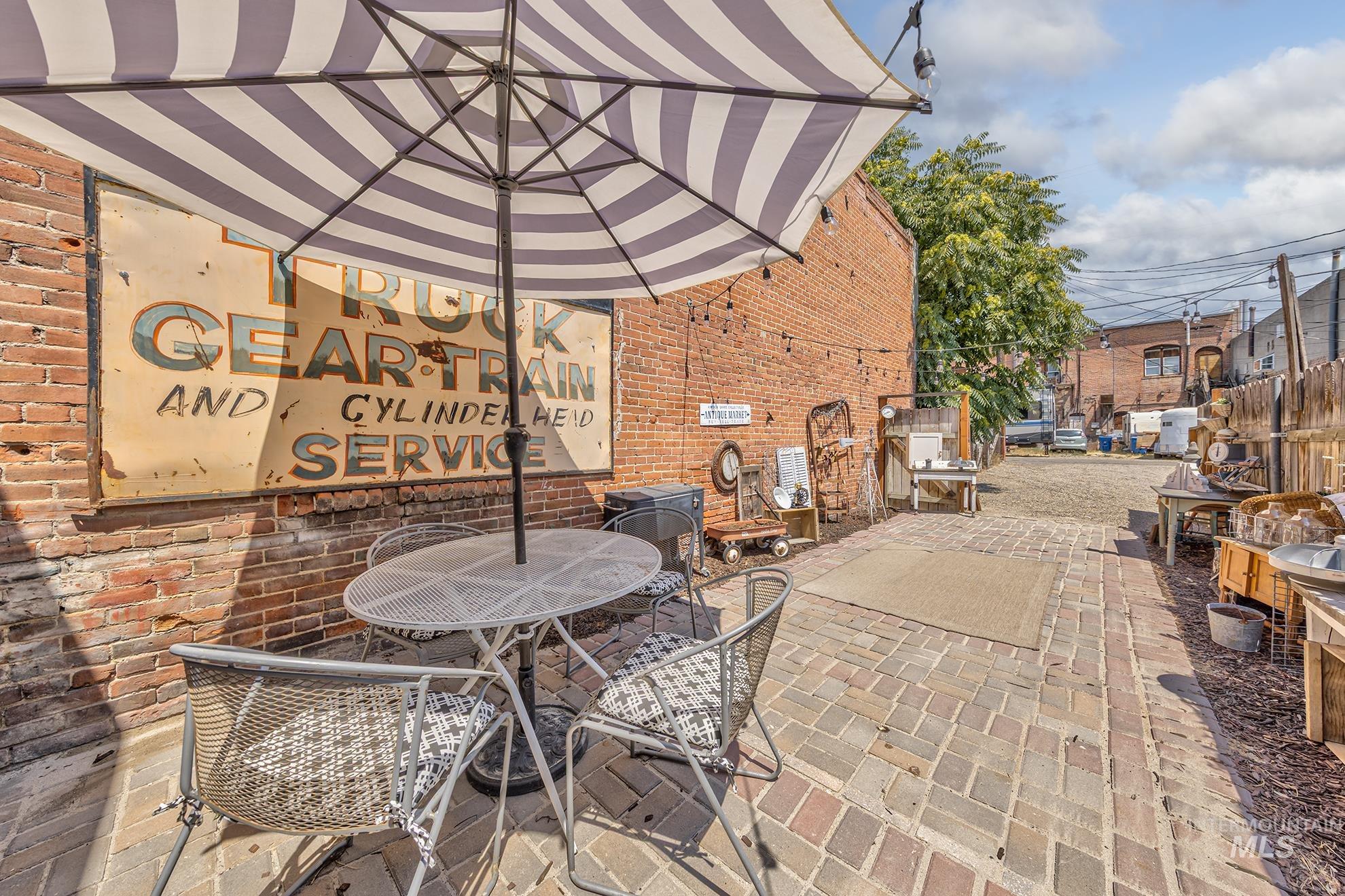View of patio featuring outdoor dining area