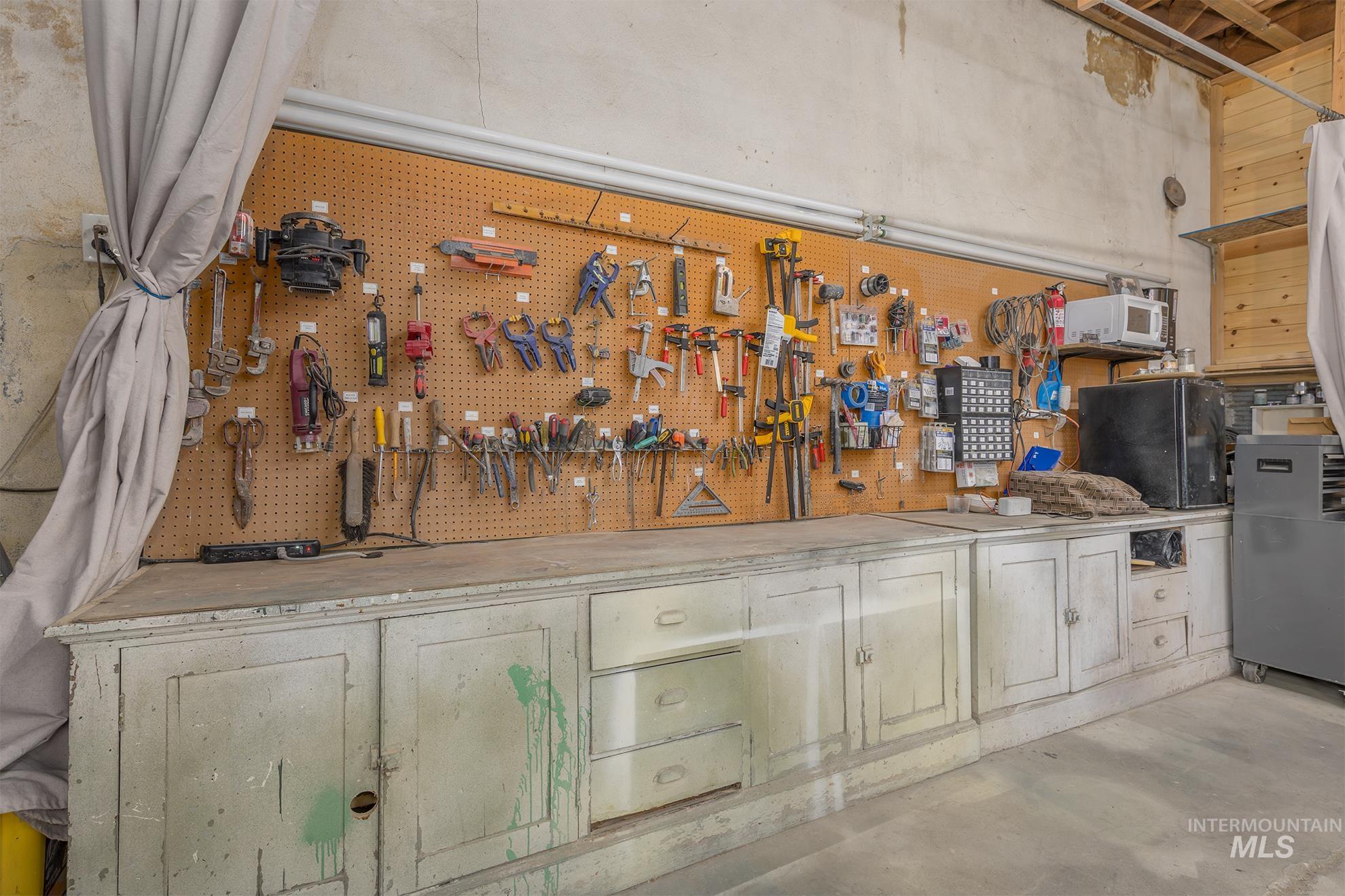 Garage featuring a workshop area