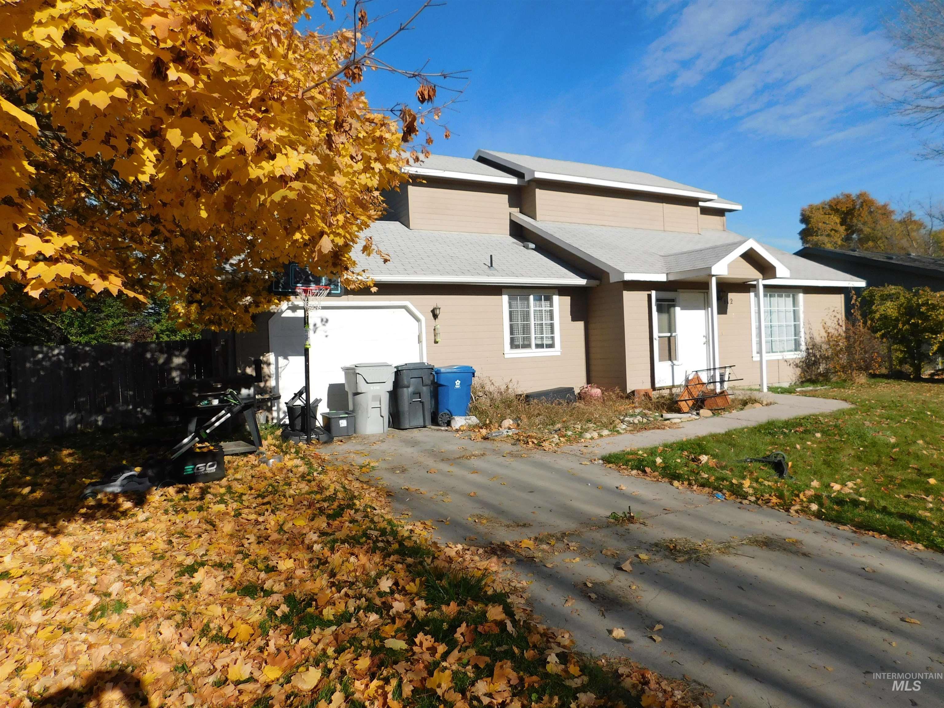 View of front of home featuring driveway and an attached garage