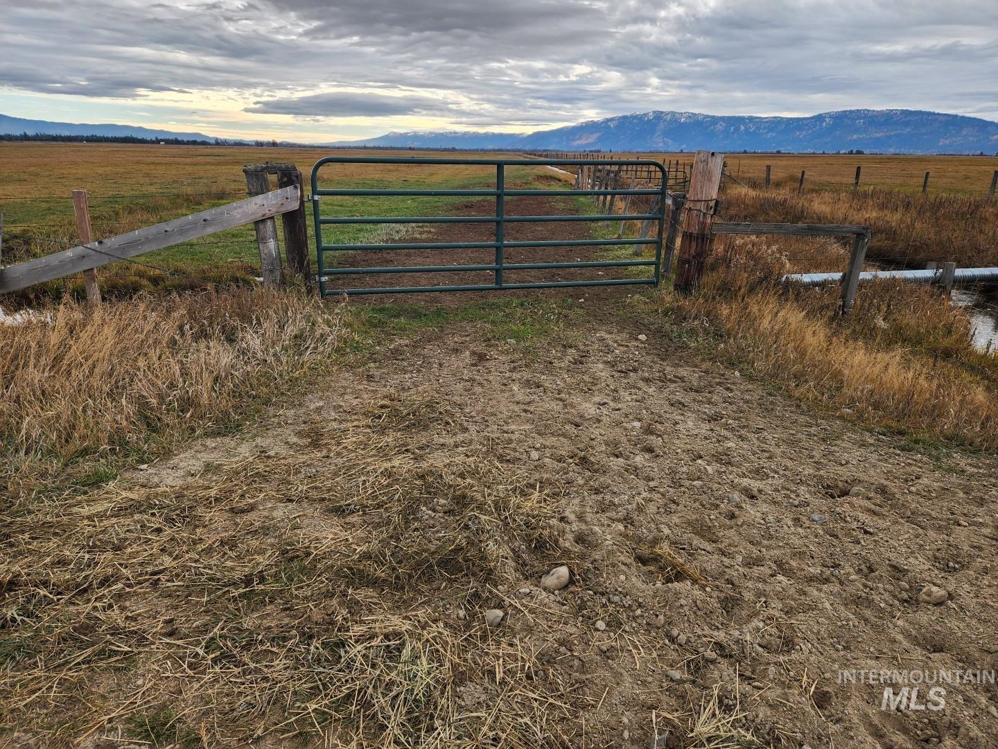 Gate featuring a rural view and a mountain view