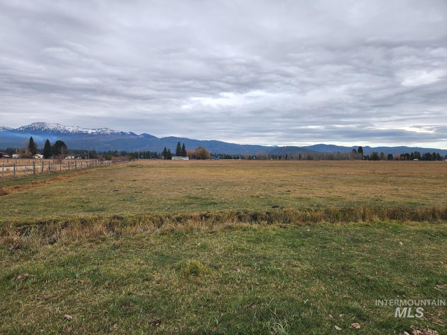 View of mountain background featuring rural landscape