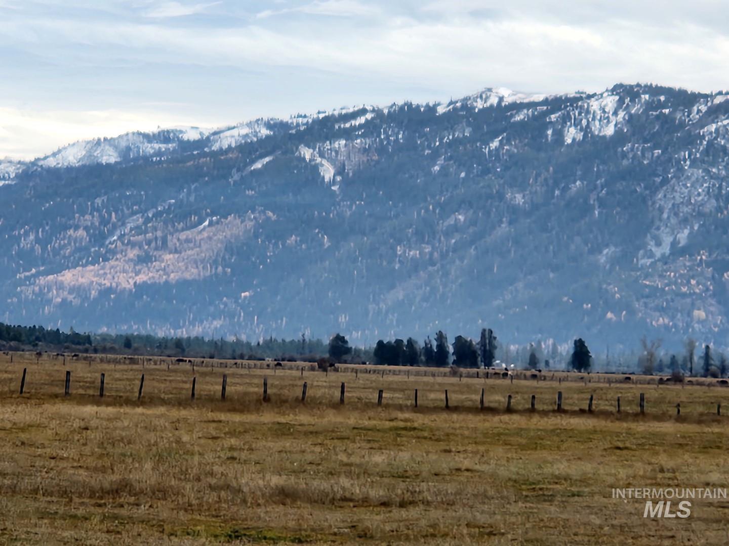 View of mountain backdrop featuring rural landscape