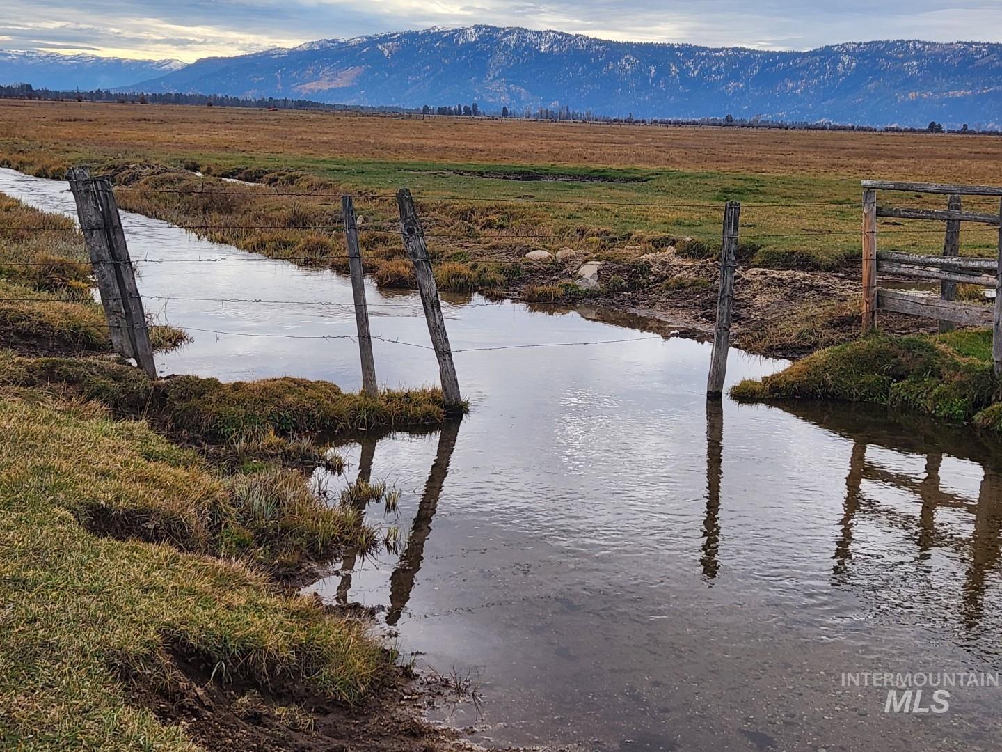 Water view featuring rural landscape and mountains