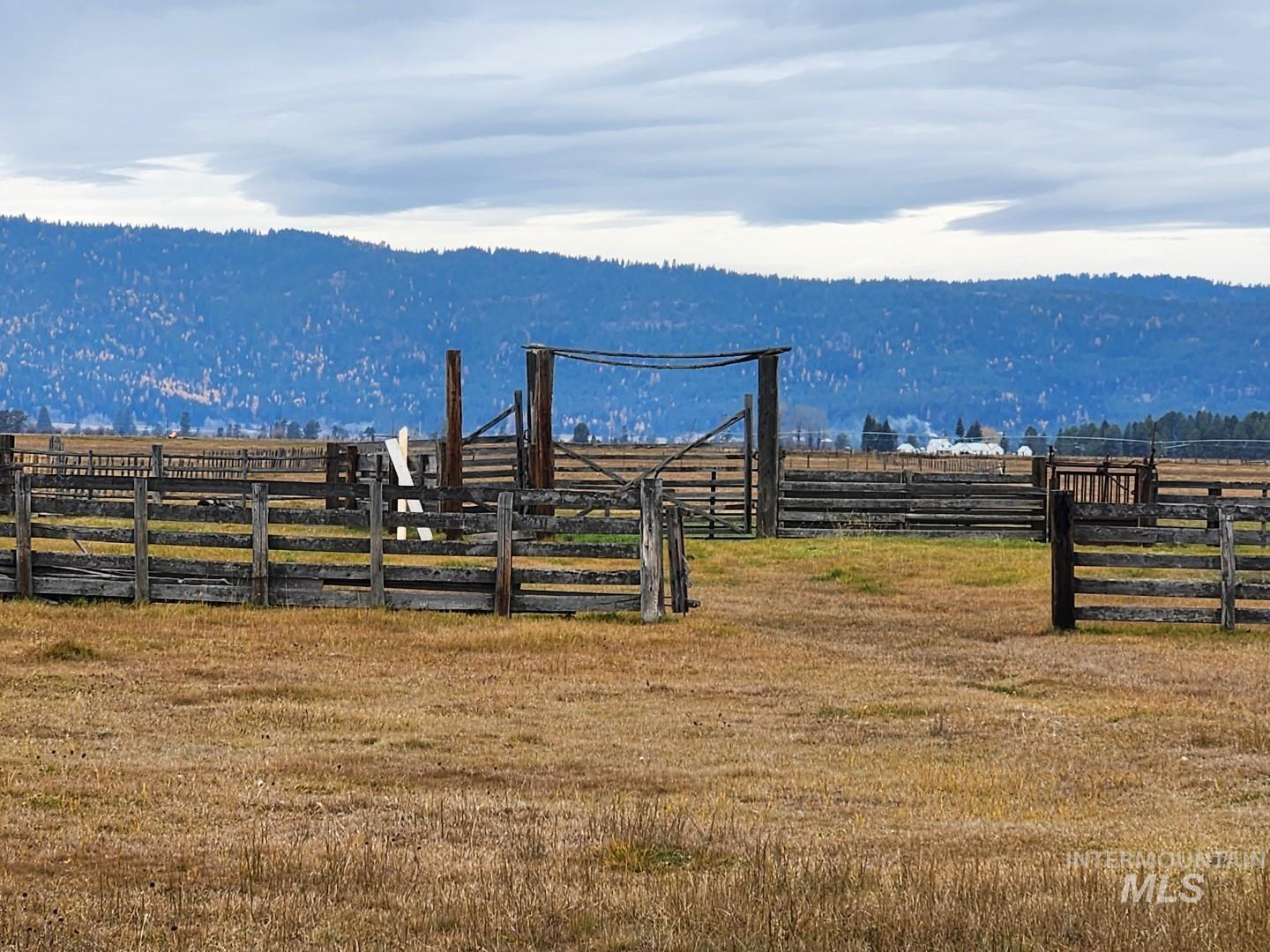 View of mountain backdrop featuring rural landscape