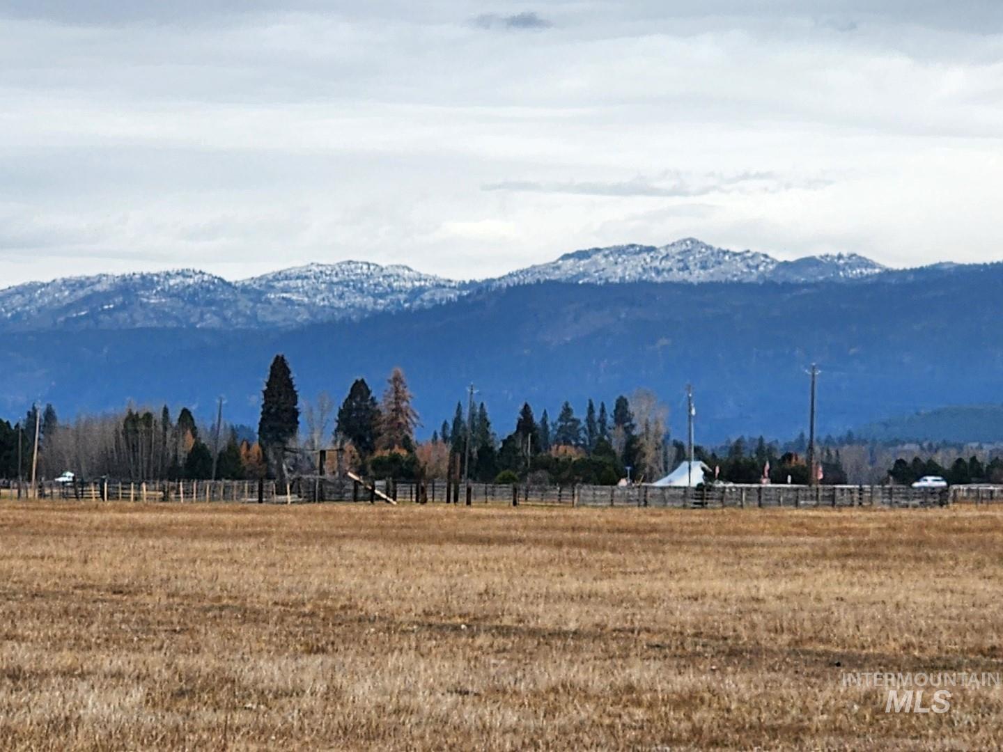 View of mountain background featuring rural landscape