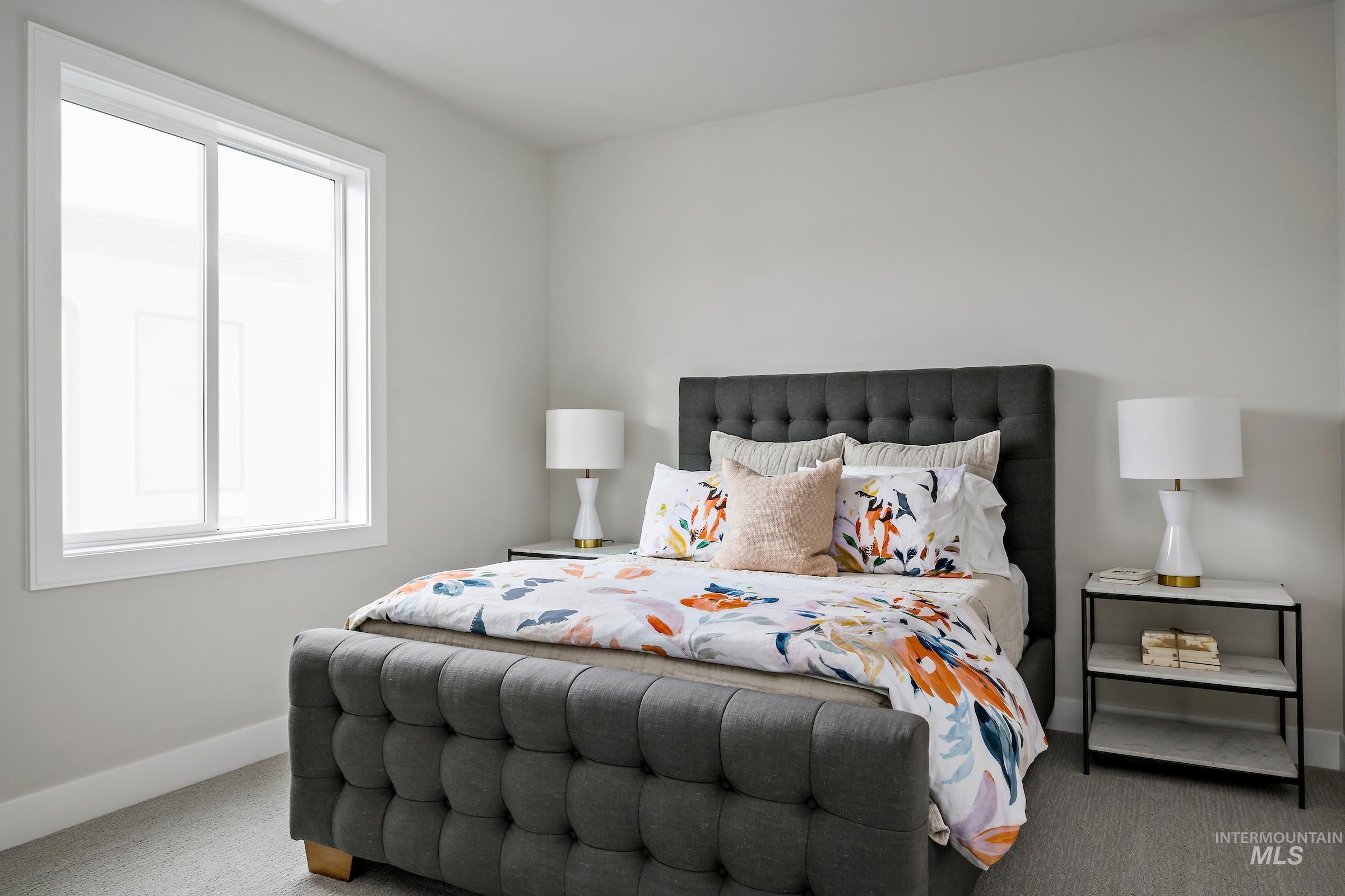 Bedroom with carpet flooring and baseboards