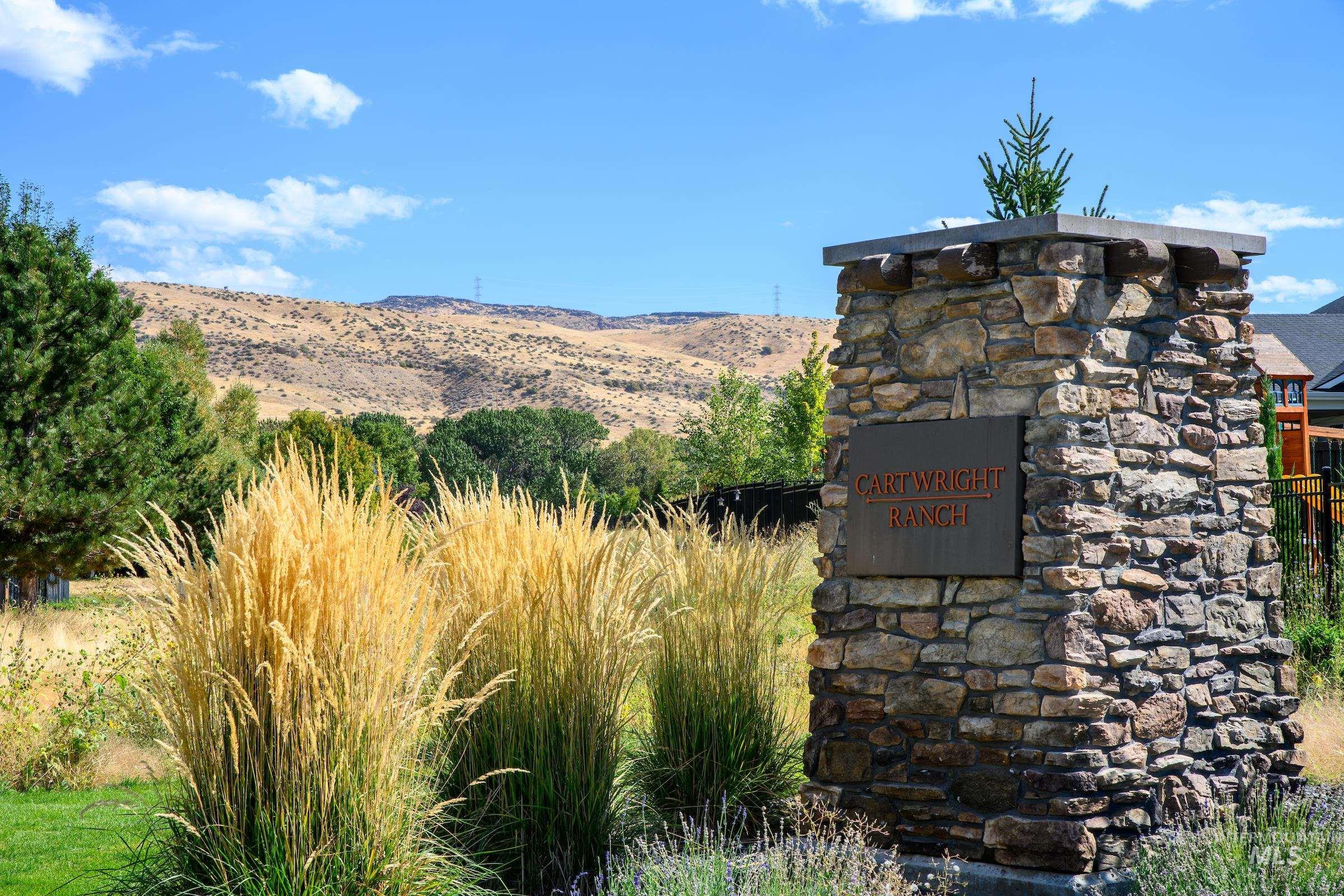 Community sign with a mountain view