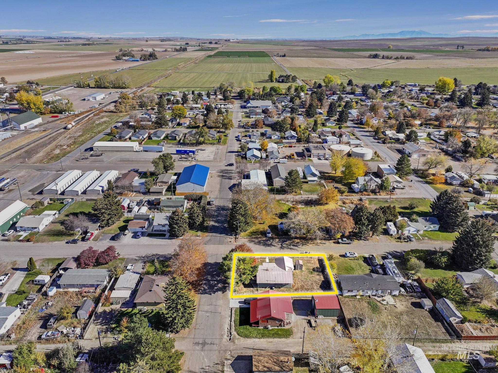 View of rural area with property boundaries highlighted and nearby suburban area