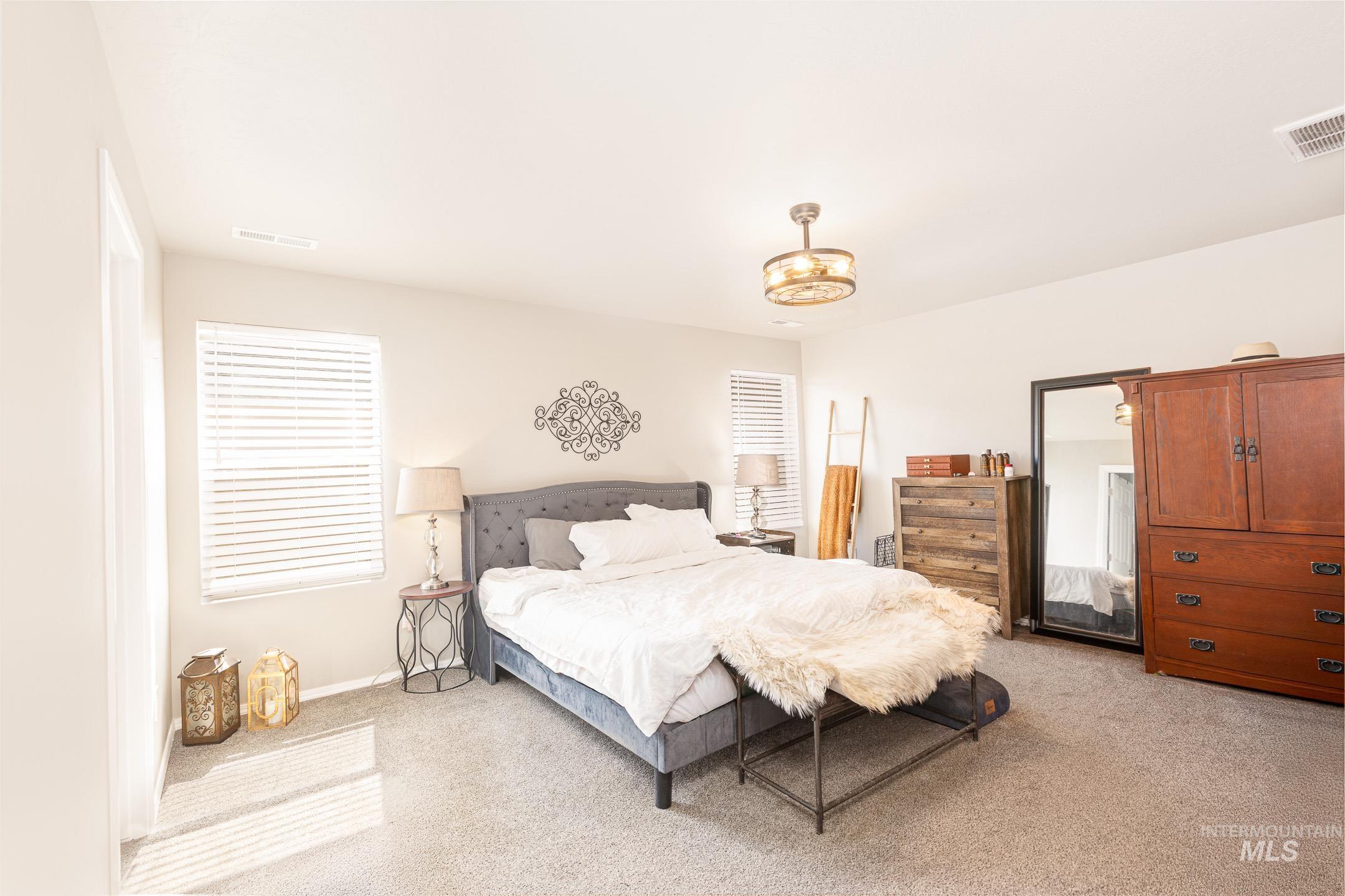 Bedroom with light carpet
