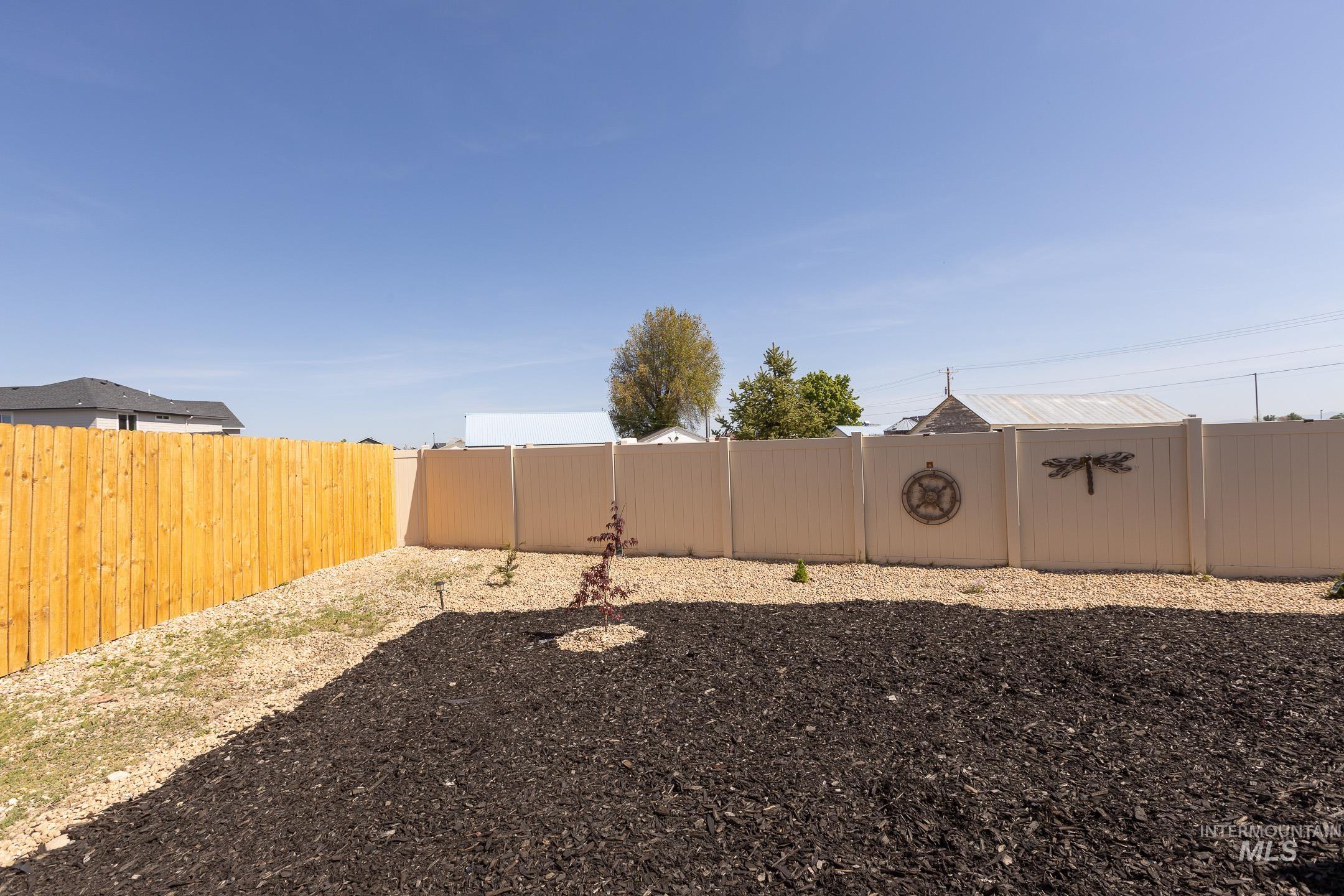 View of fenced backyard