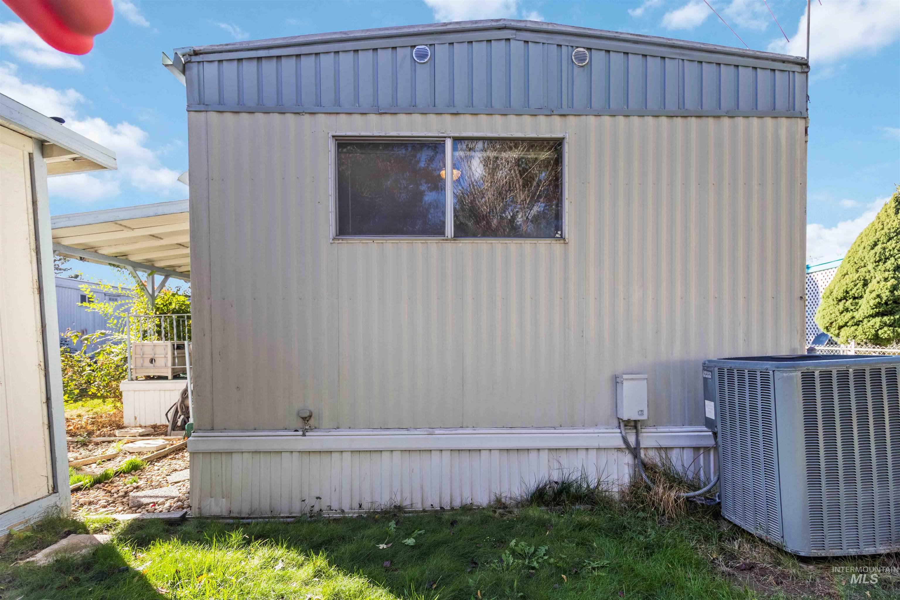 View of home's exterior with a central AC unit