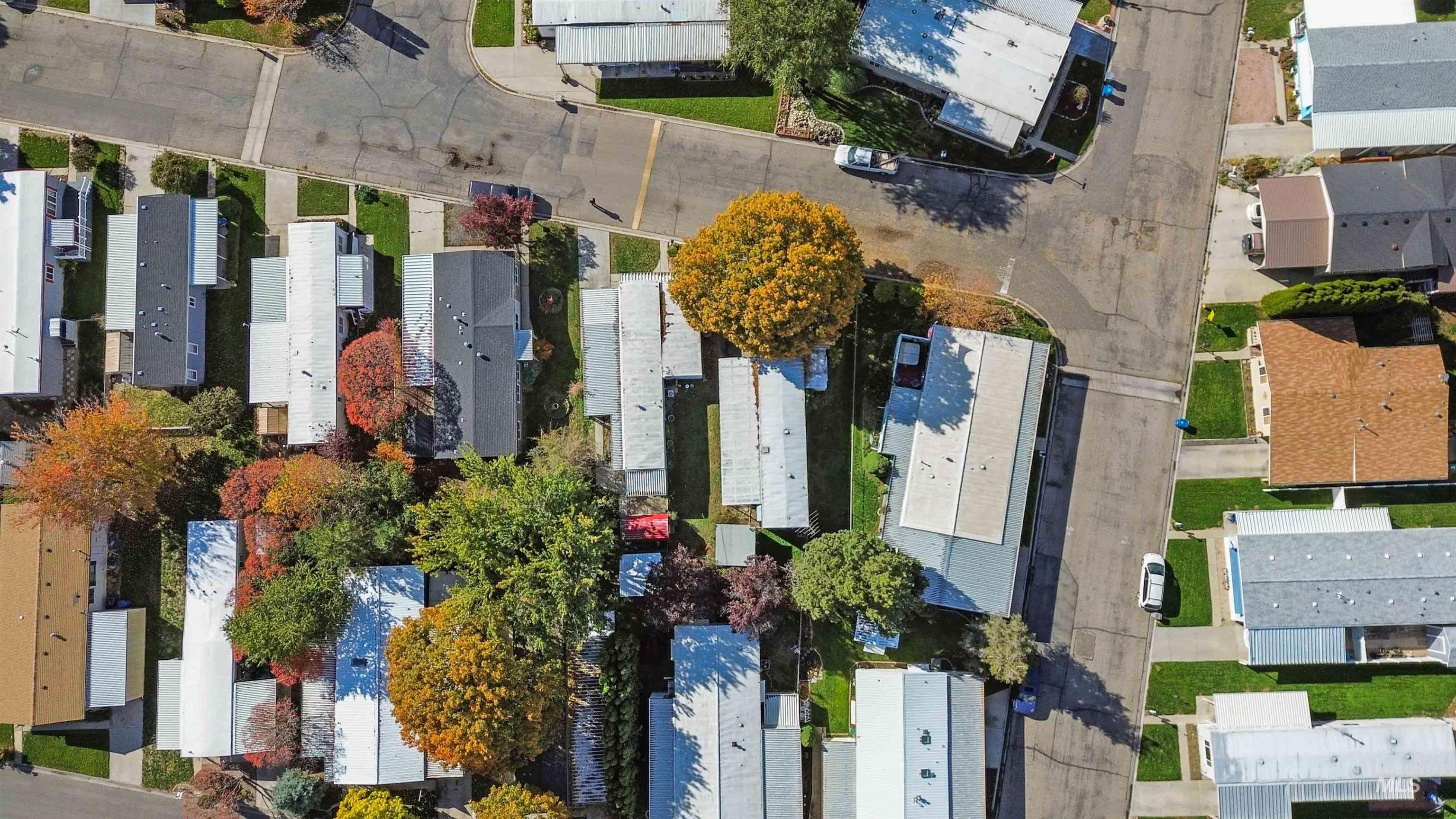 Aerial overview of property's location with nearby suburban area
