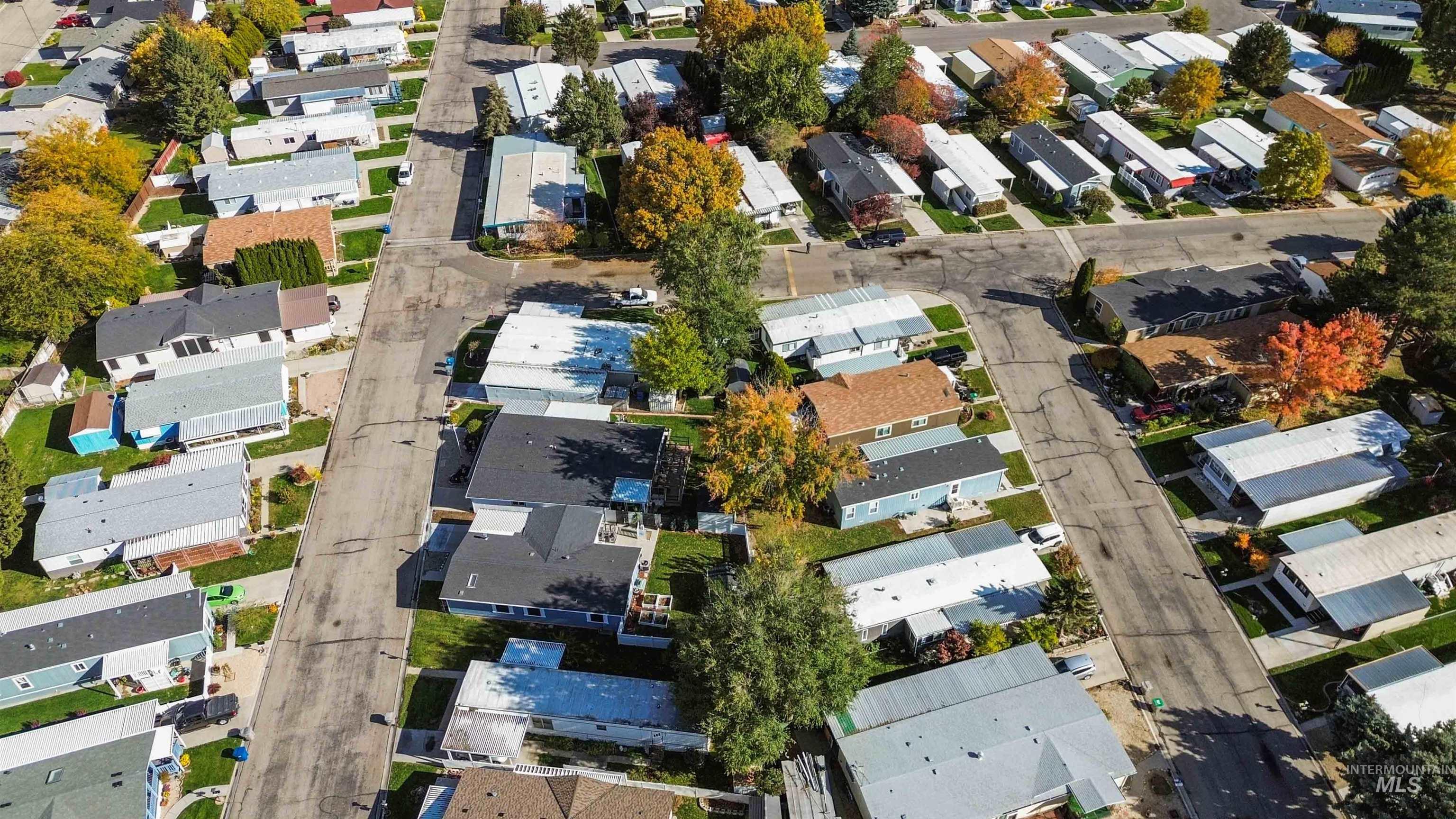 Aerial view of property's location featuring nearby suburban area