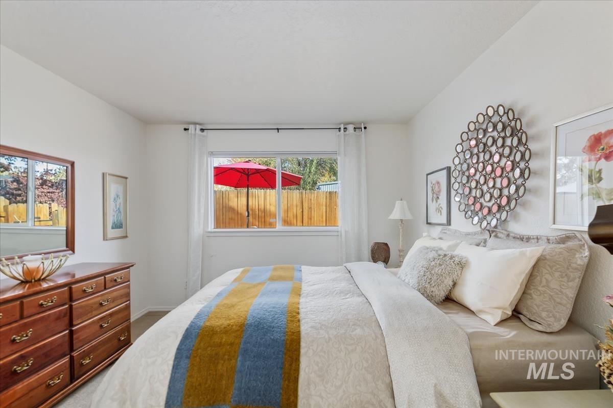 Carpeted bedroom with baseboards