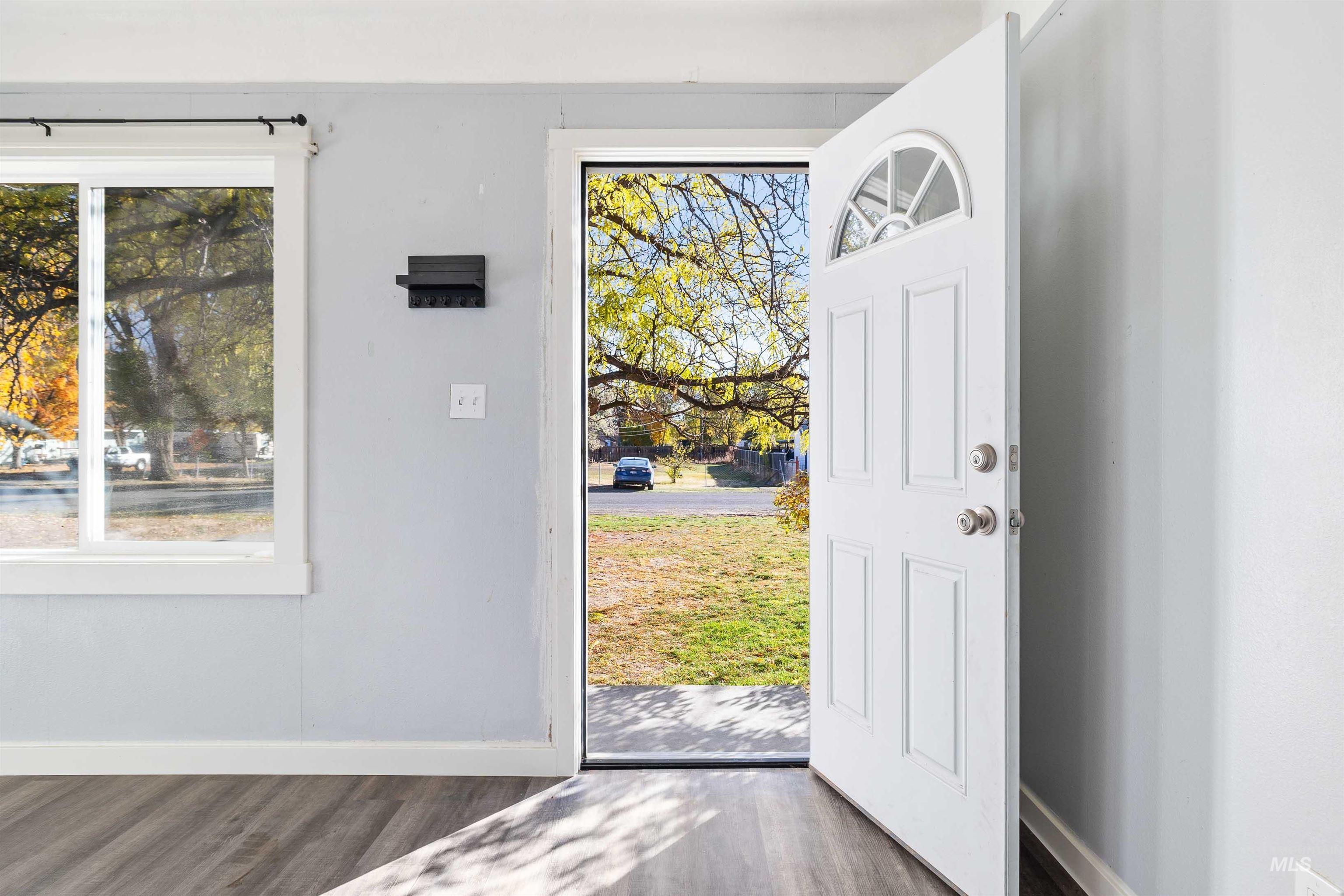 Entryway with dark wood-type flooring