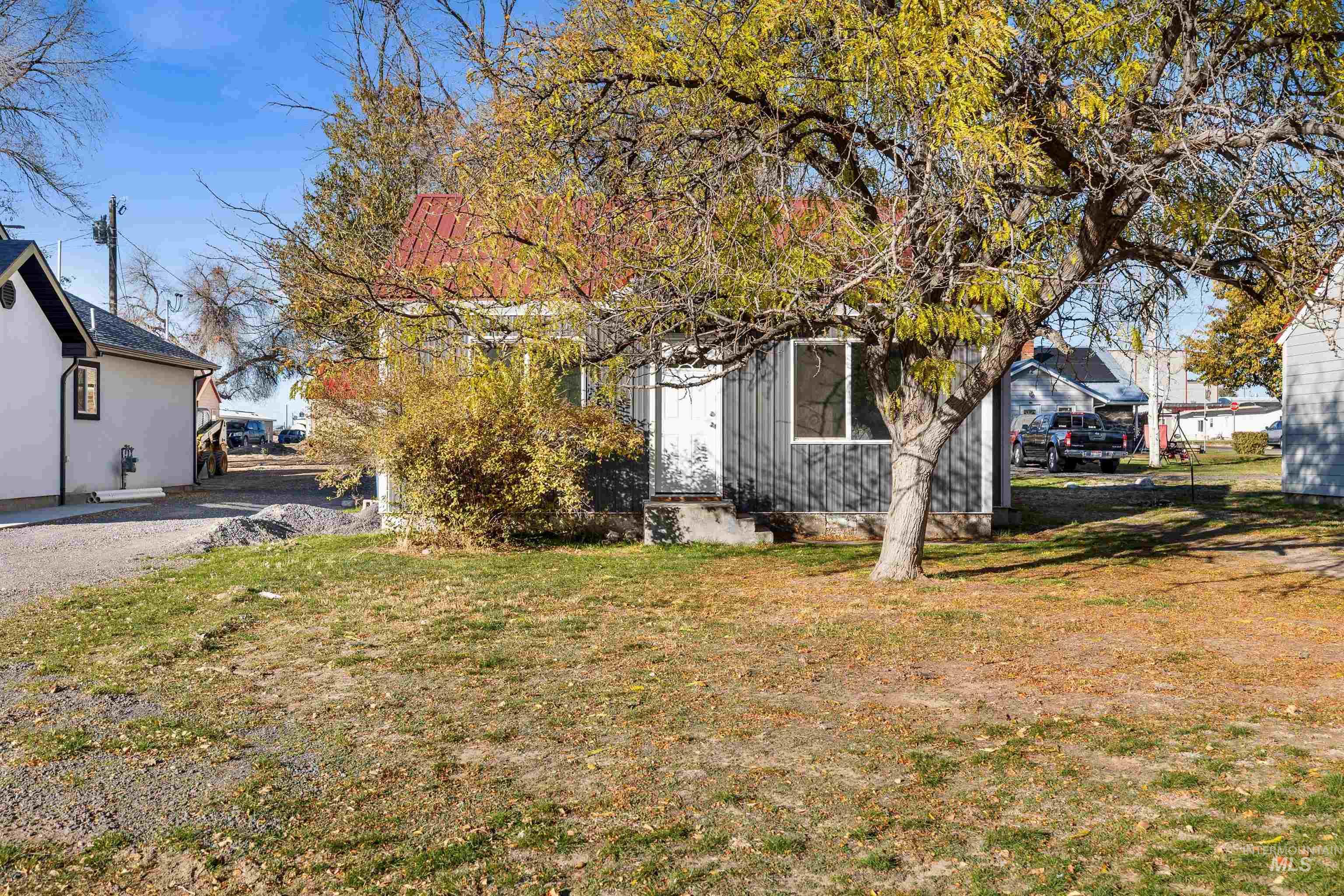 View of property exterior with a lawn