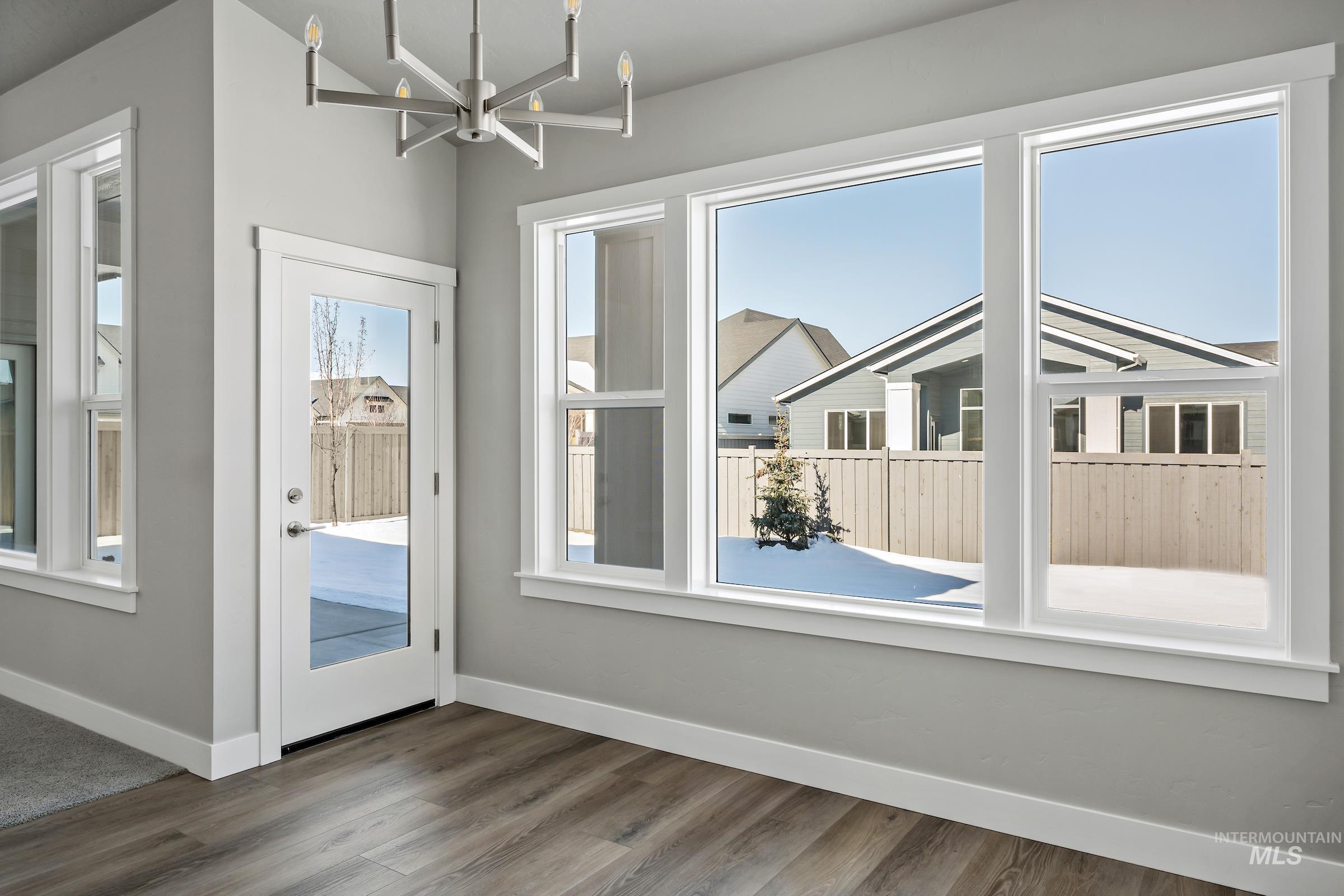 Entryway featuring a chandelier and wood finished floors