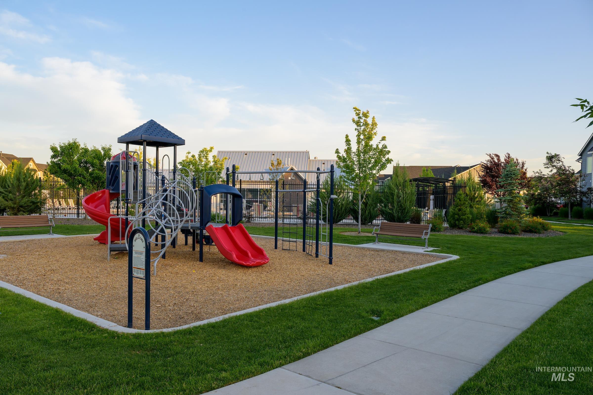 Community playground featuring a lawn