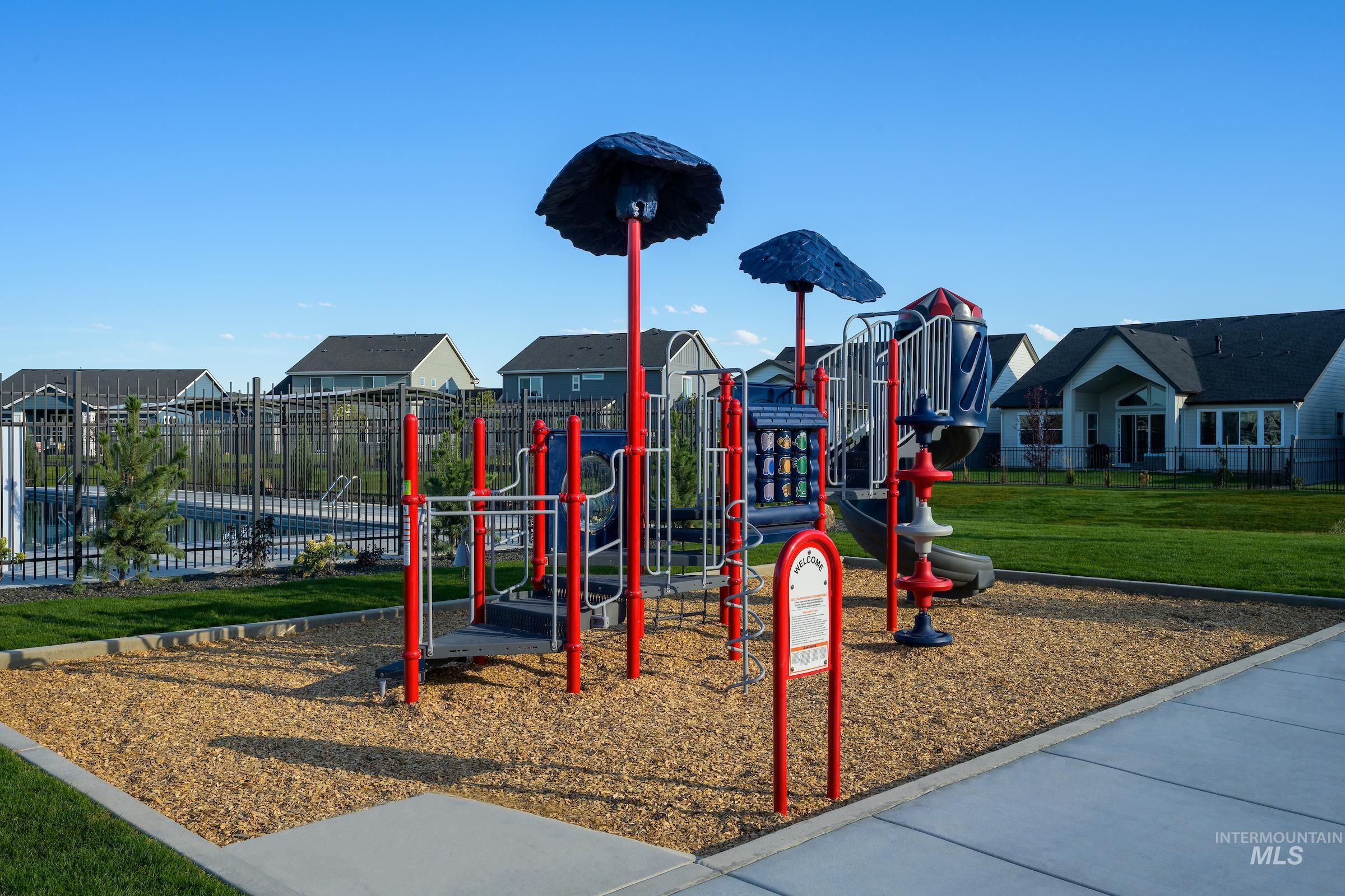 Community playground featuring a residential view