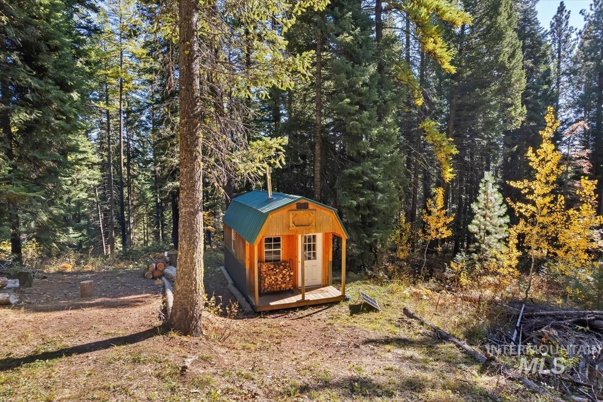 View of shed featuring a wooded view