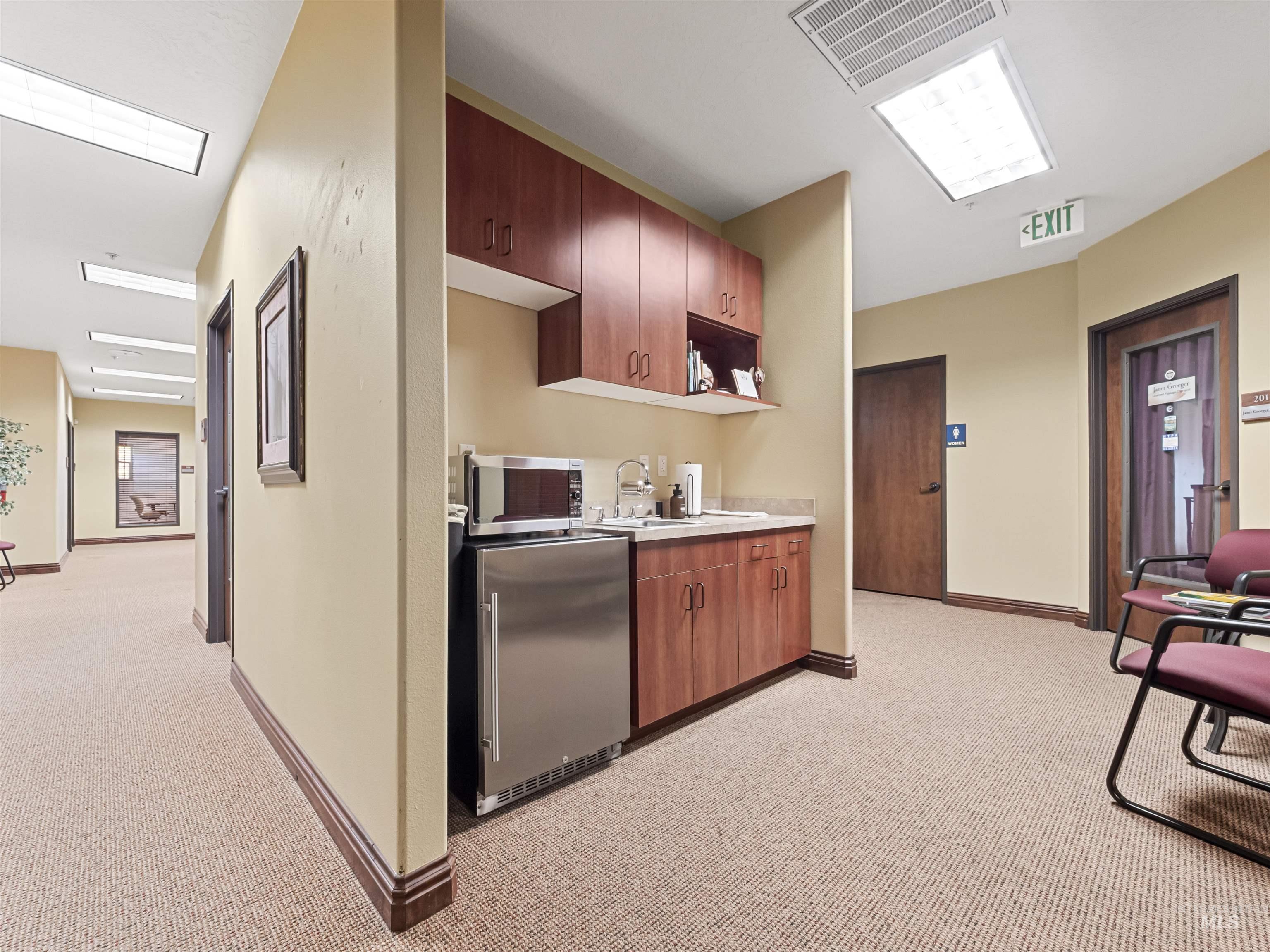 Kitchen featuring light countertops and stainless steel appliances