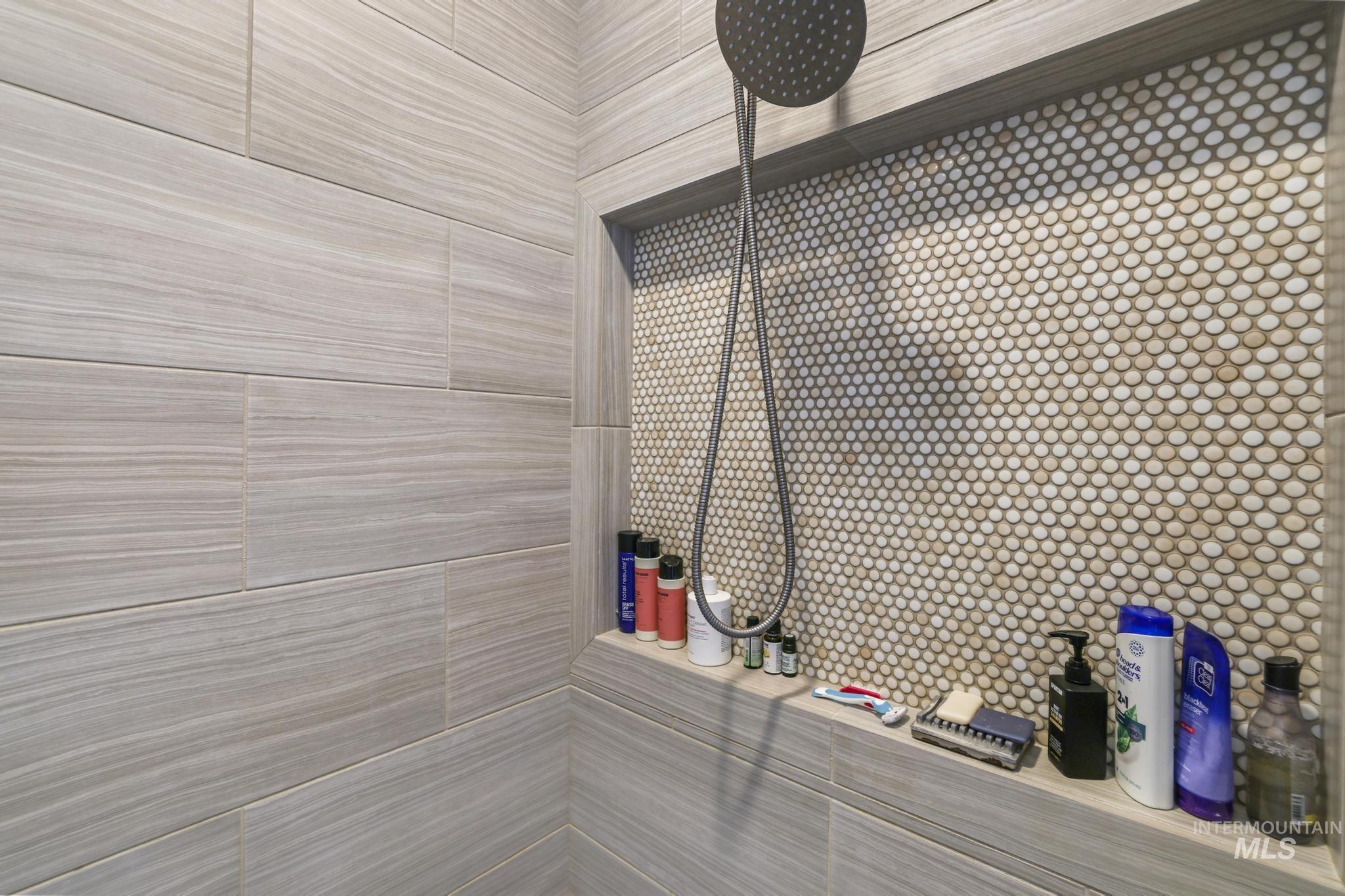 Bathroom view of a tile shower