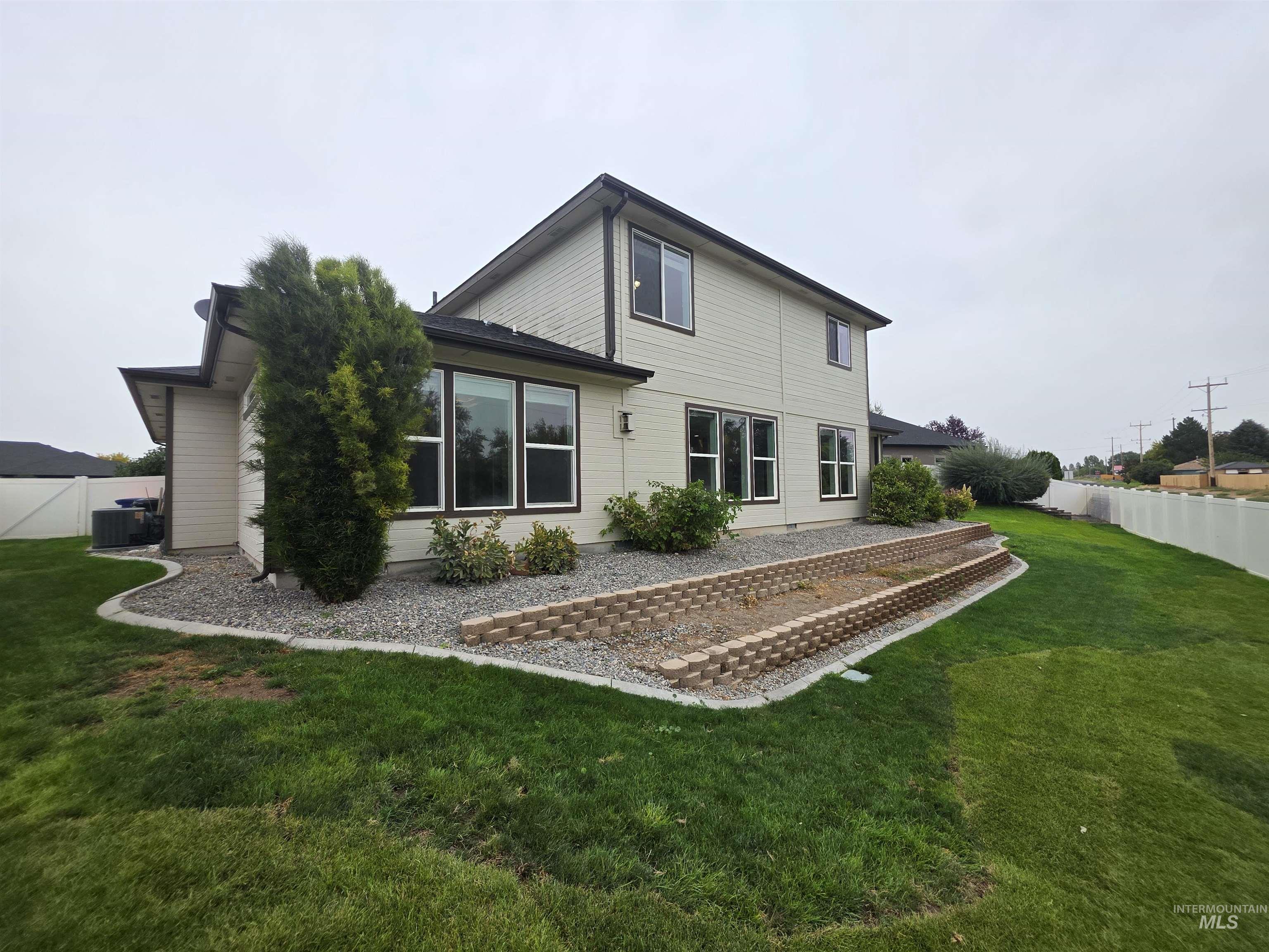 Back of house with a patio area