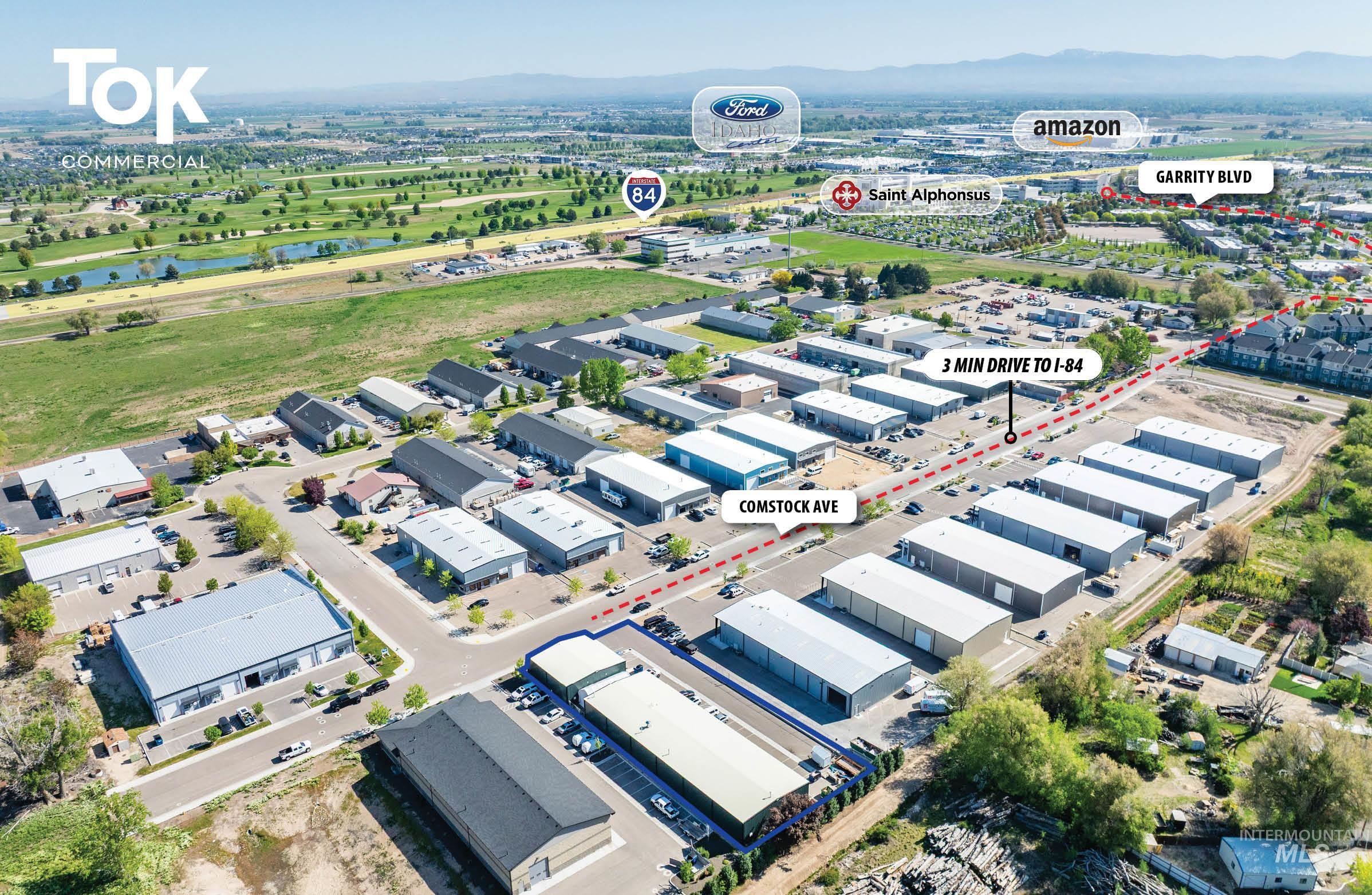 Drone / aerial view of an industrial area and a nearby body of water