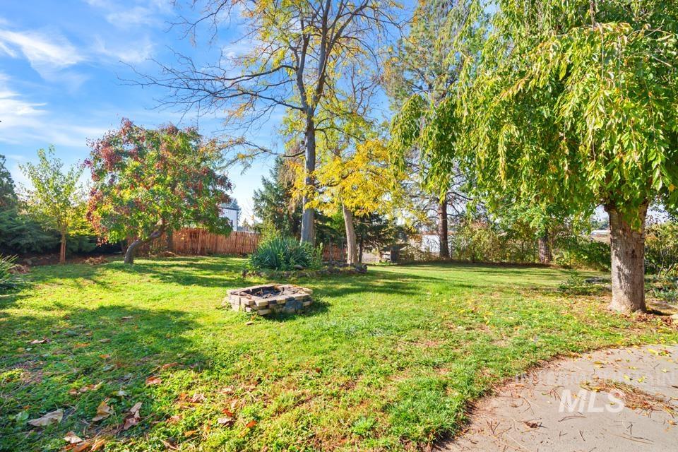 View of yard featuring a fire pit