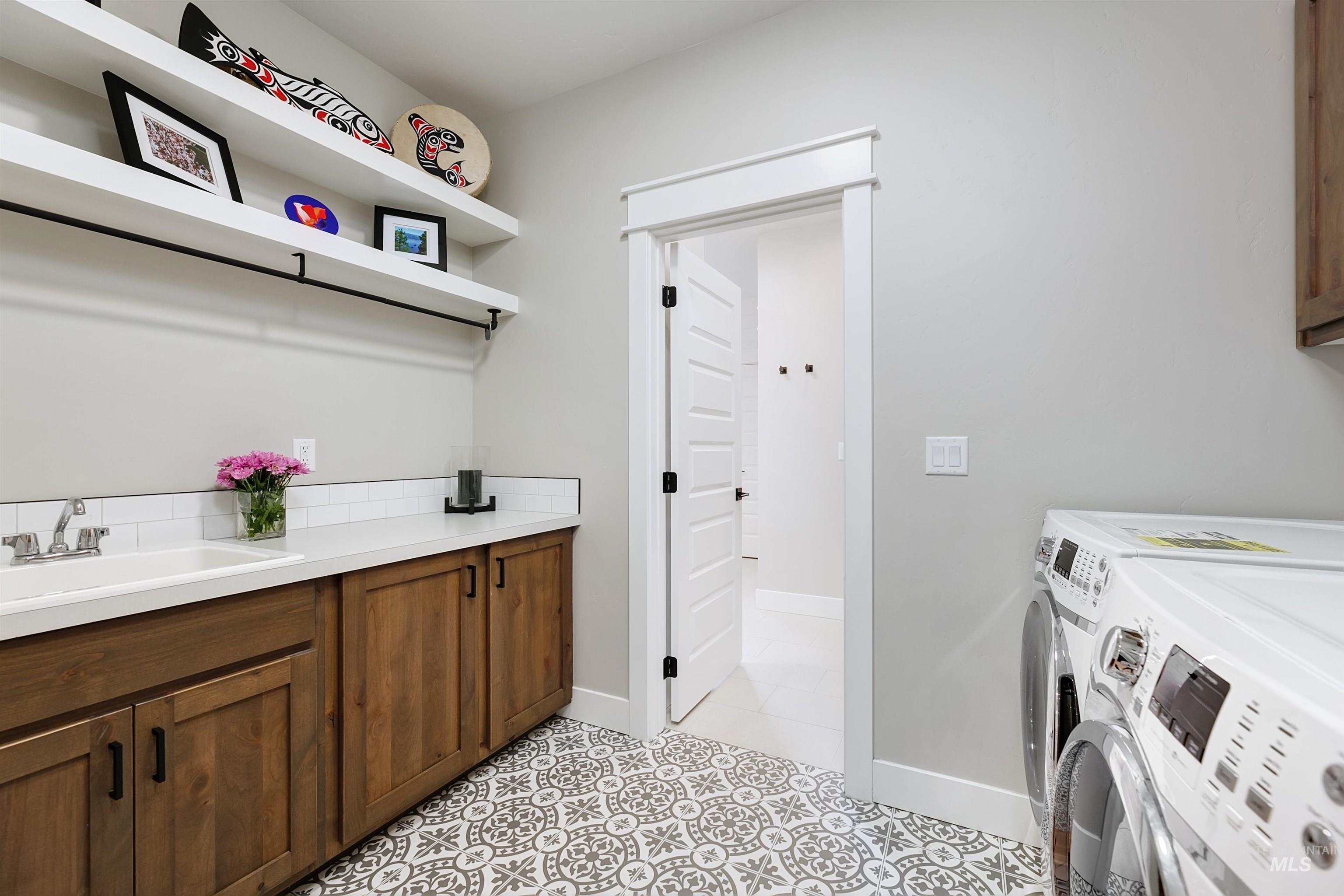 Downstairs laundry room conveniently connects to primary en-suite.