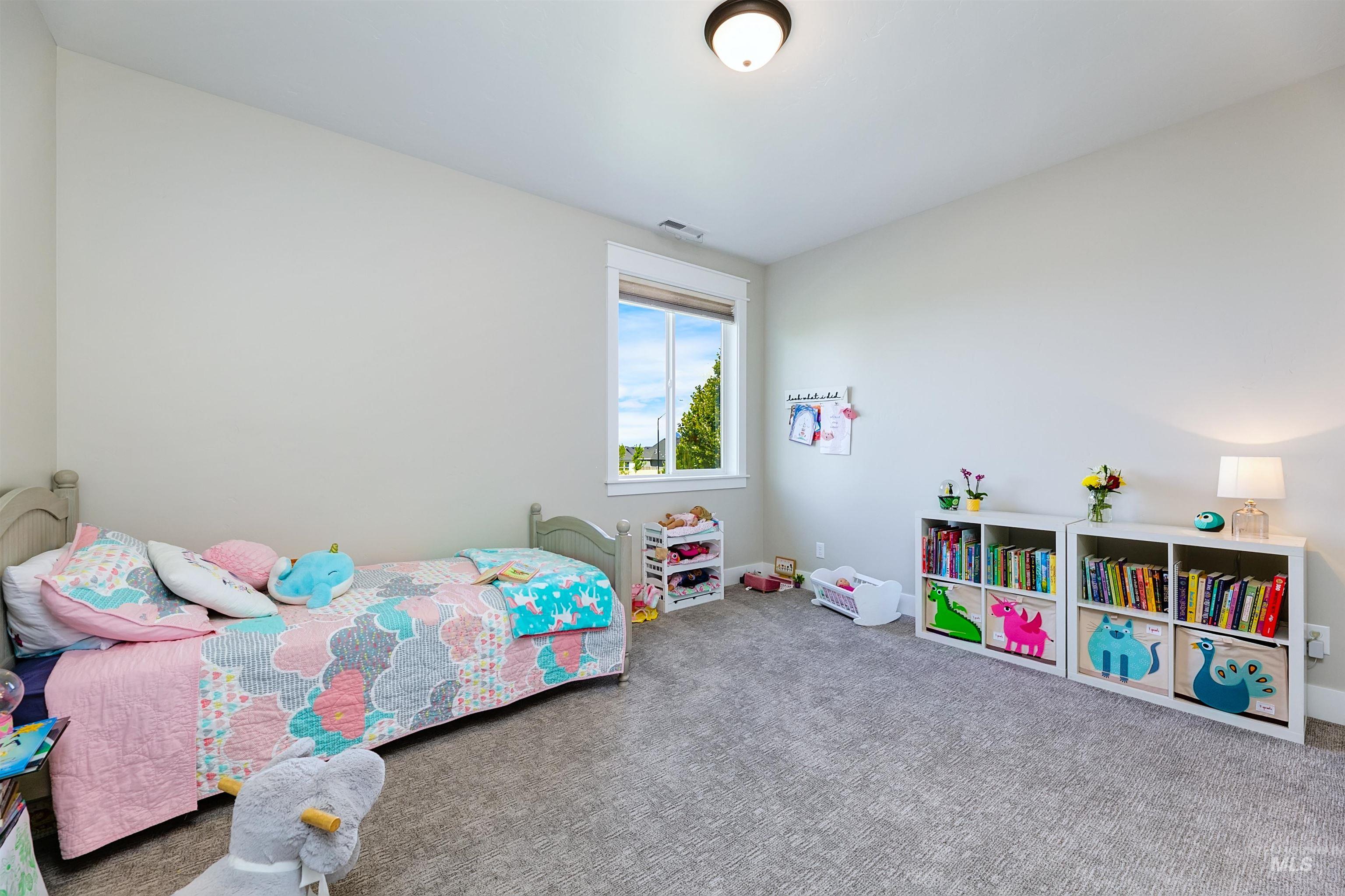 Large upstairs bedroom with walk-in closet.