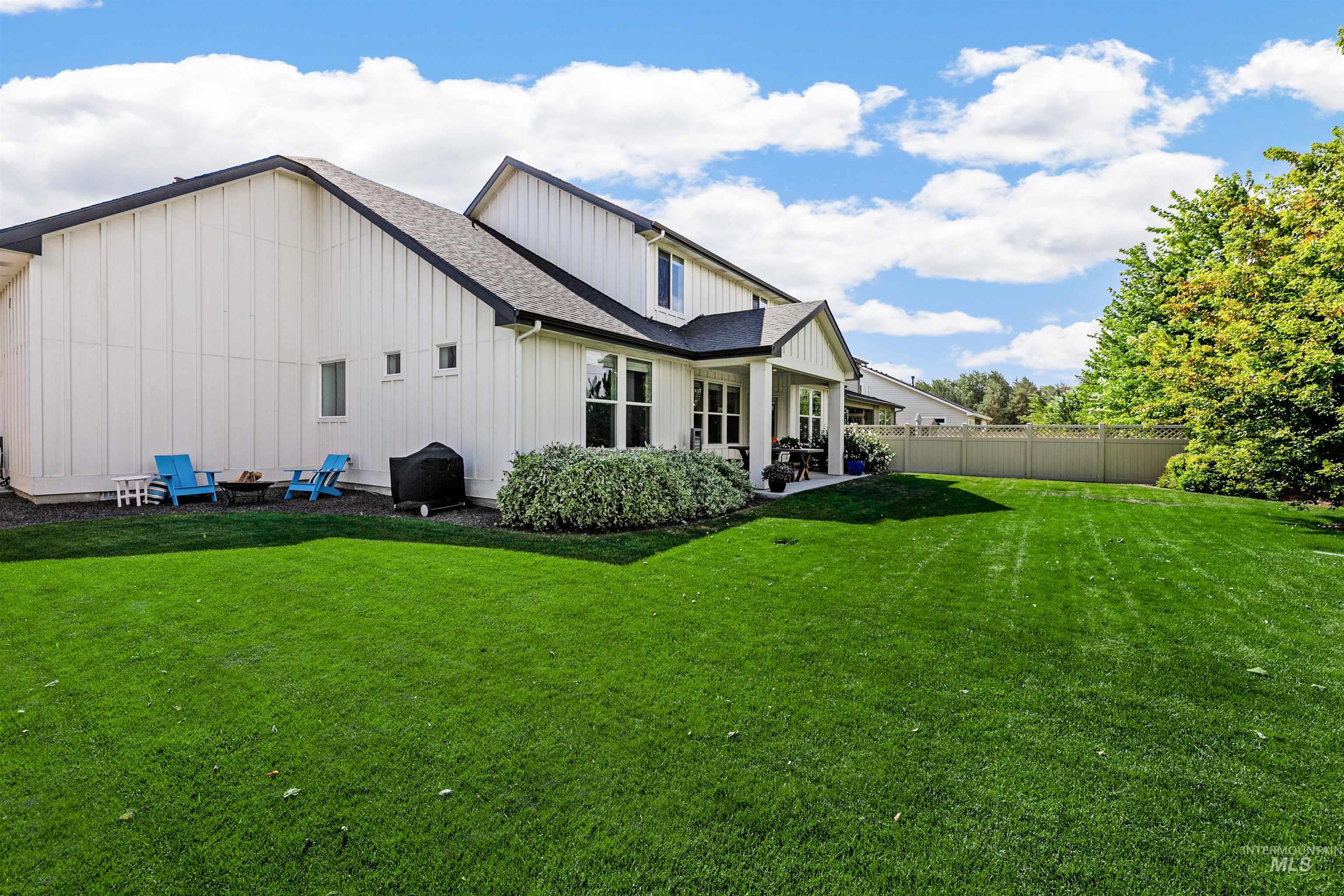 Back of house with pocket patio perfect for a fire pit.