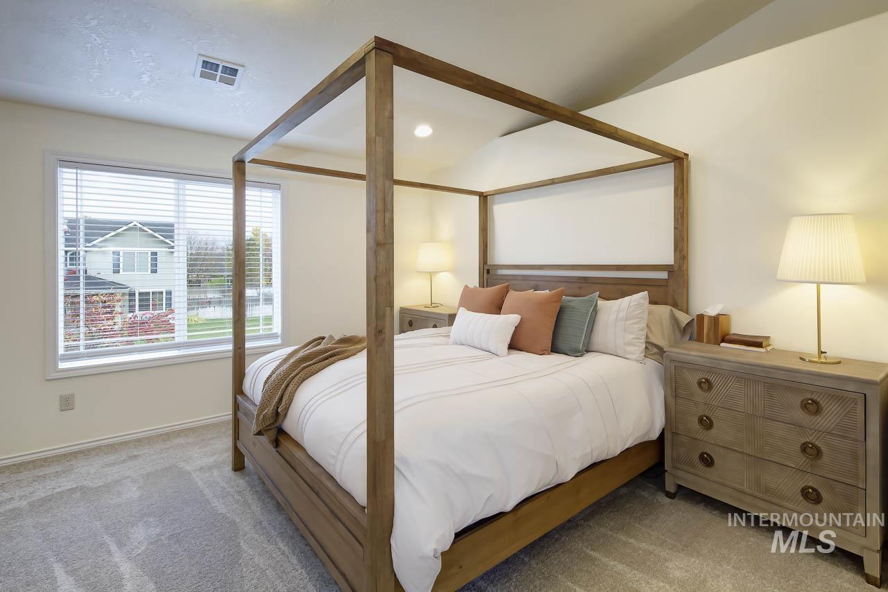 Carpeted bedroom with baseboards