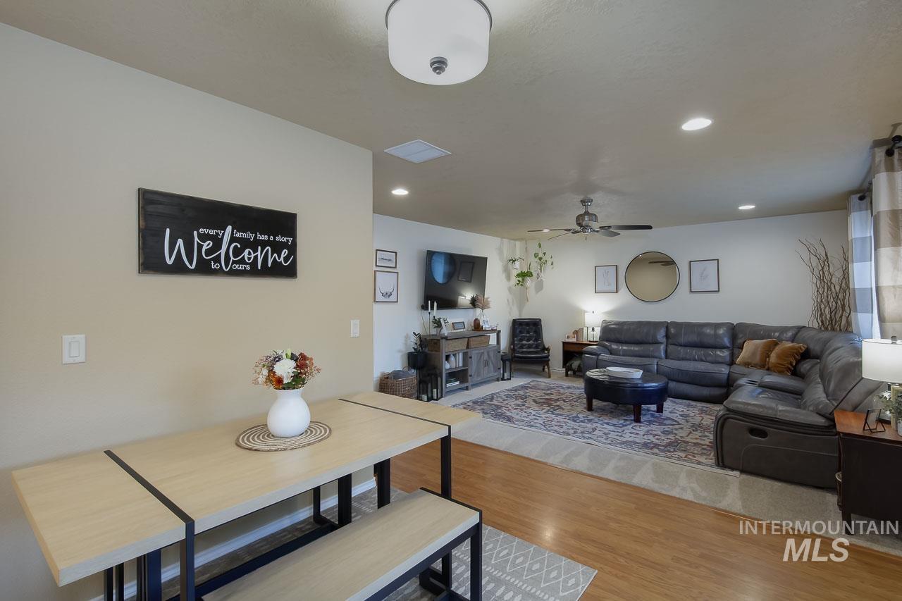 Dining space featuring wood finished floors, recessed lighting, and ceiling fan