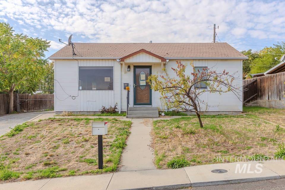 Bungalow-style home featuring a shingled roof