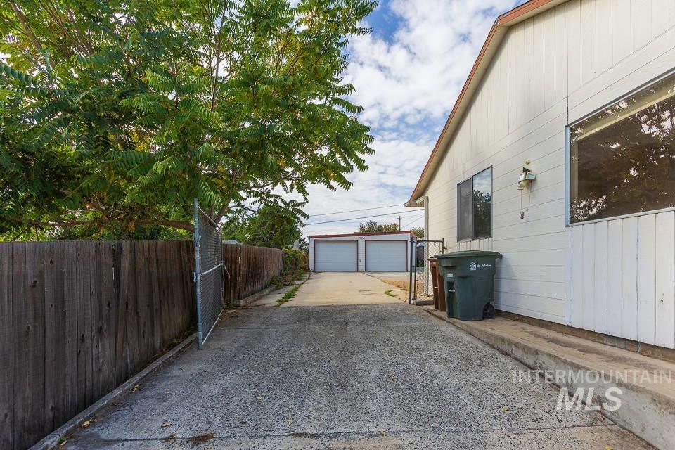 View of home's exterior featuring an outdoor structure and a garage