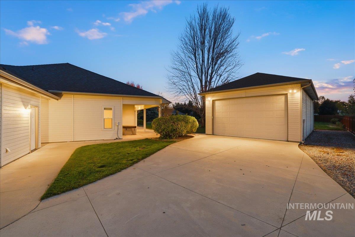 Property exterior at dusk with an outbuilding