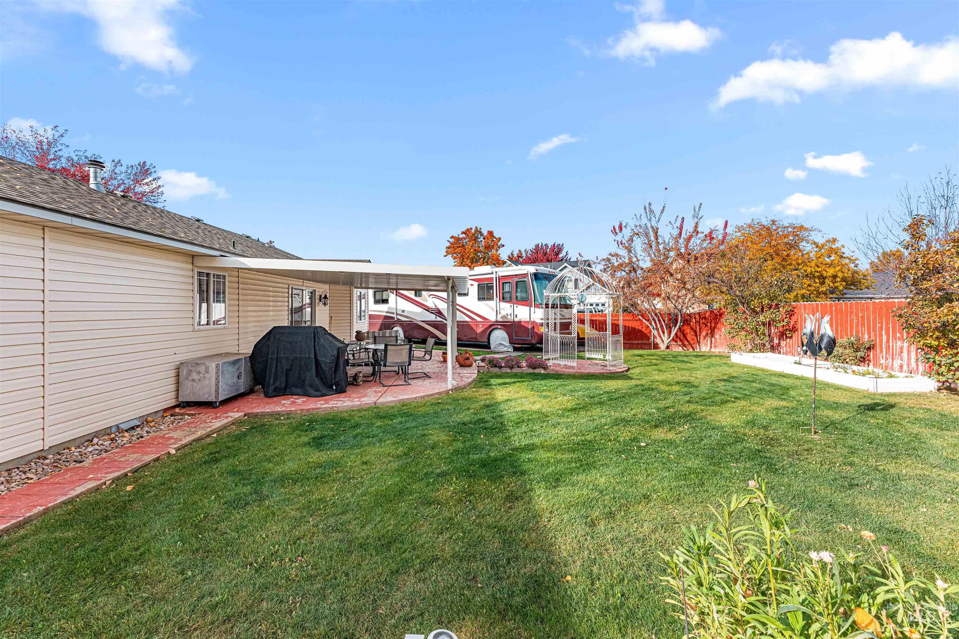 Fenced backyard with a patio area
