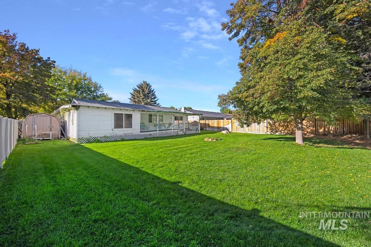 Rear view of property featuring a fenced backyard